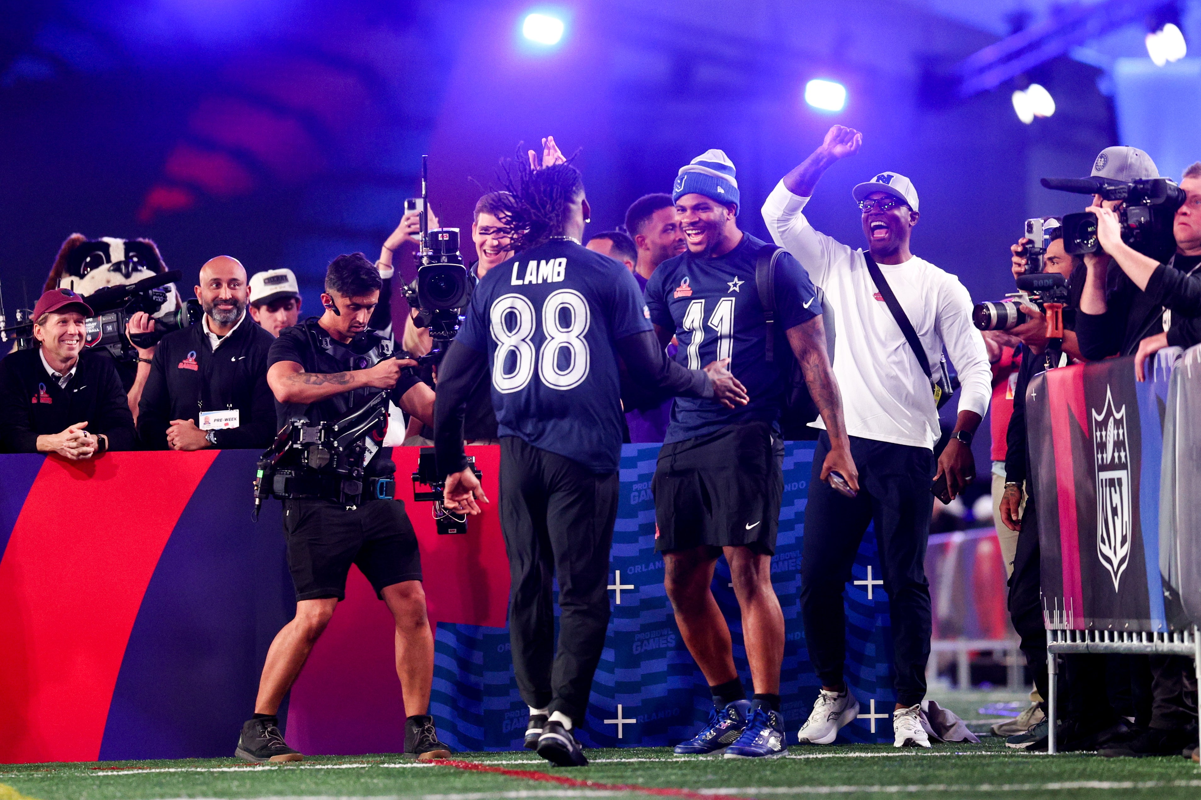 Dallas Cowboys wide receiver CeeDee Lamb (88) and linebacker Micah Parsons (11) celebrate during the NFL Pro Bowl Skills Competition at the UCF NIcholson Fieldhouse.