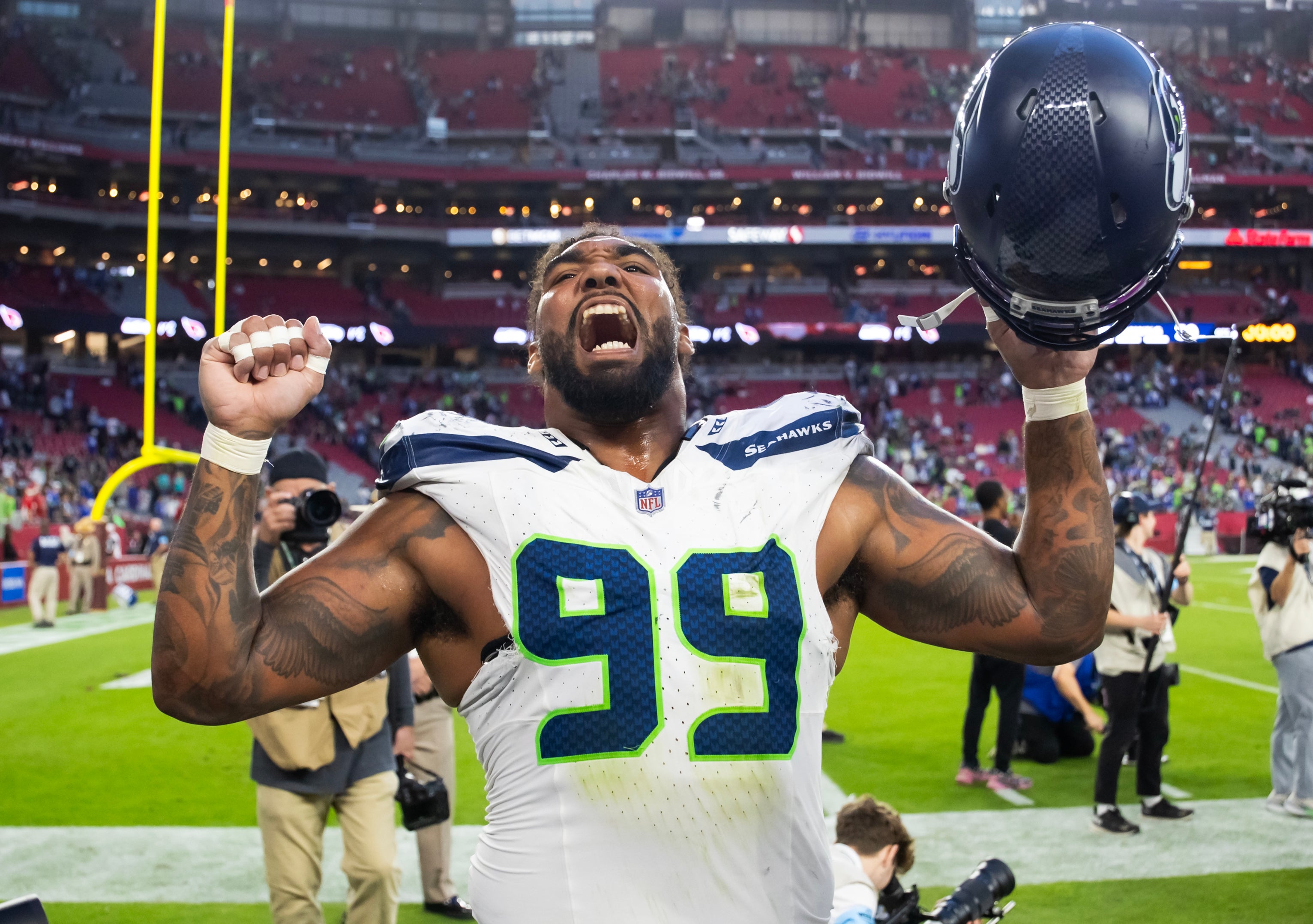 Dec 8, 2024; Glendale, Arizona, USA; Seattle Seahawks defensive end Leonard Williams (99) celebrates after defeating the Arizona Cardinals at State Farm Stadium.