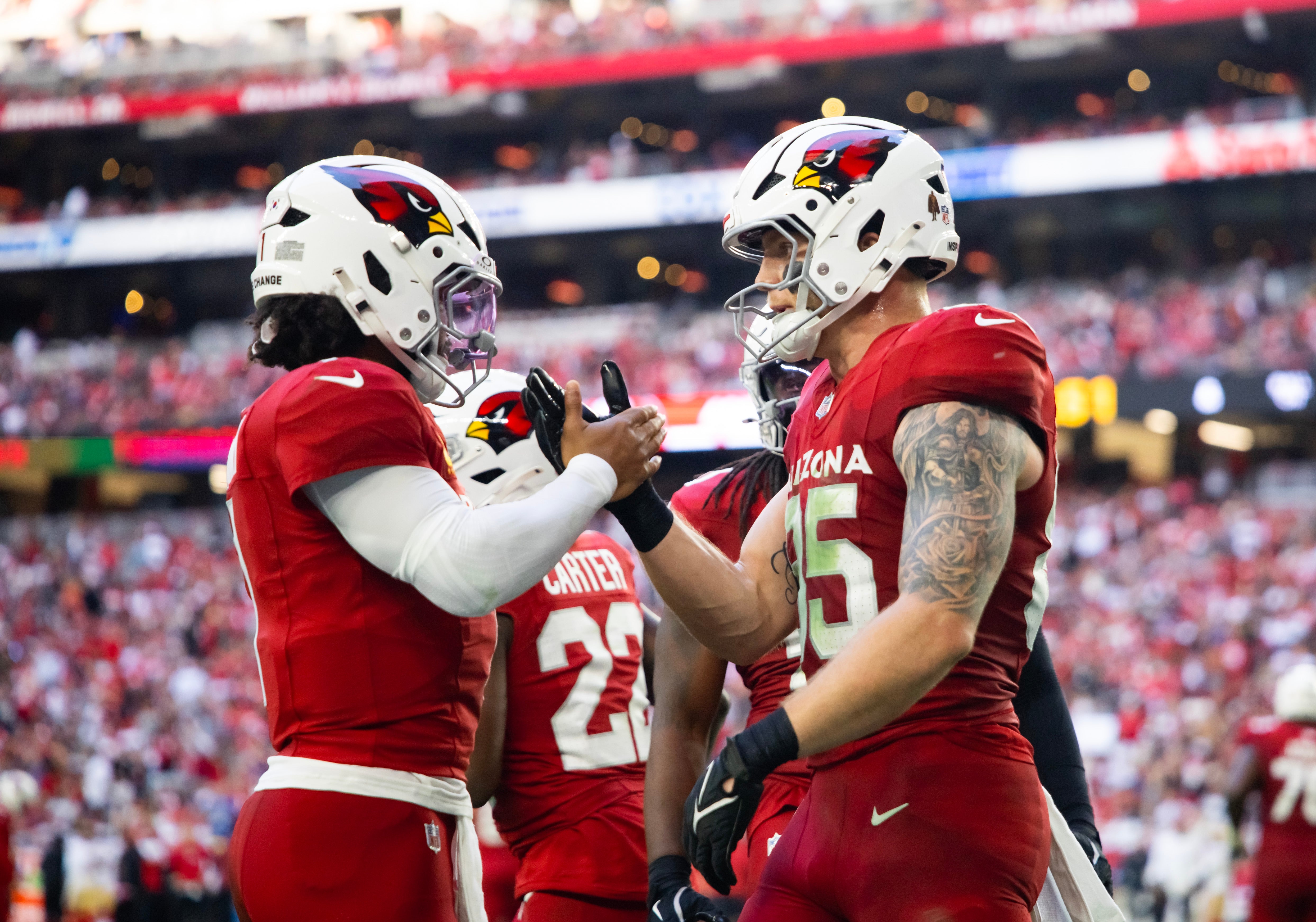 Arizona Cardinals quarterback Kyler Murray (1) celebrates a touchdown with tight end Trey McBride (85) against the San Francisco 49ers at State Farm Stadium.