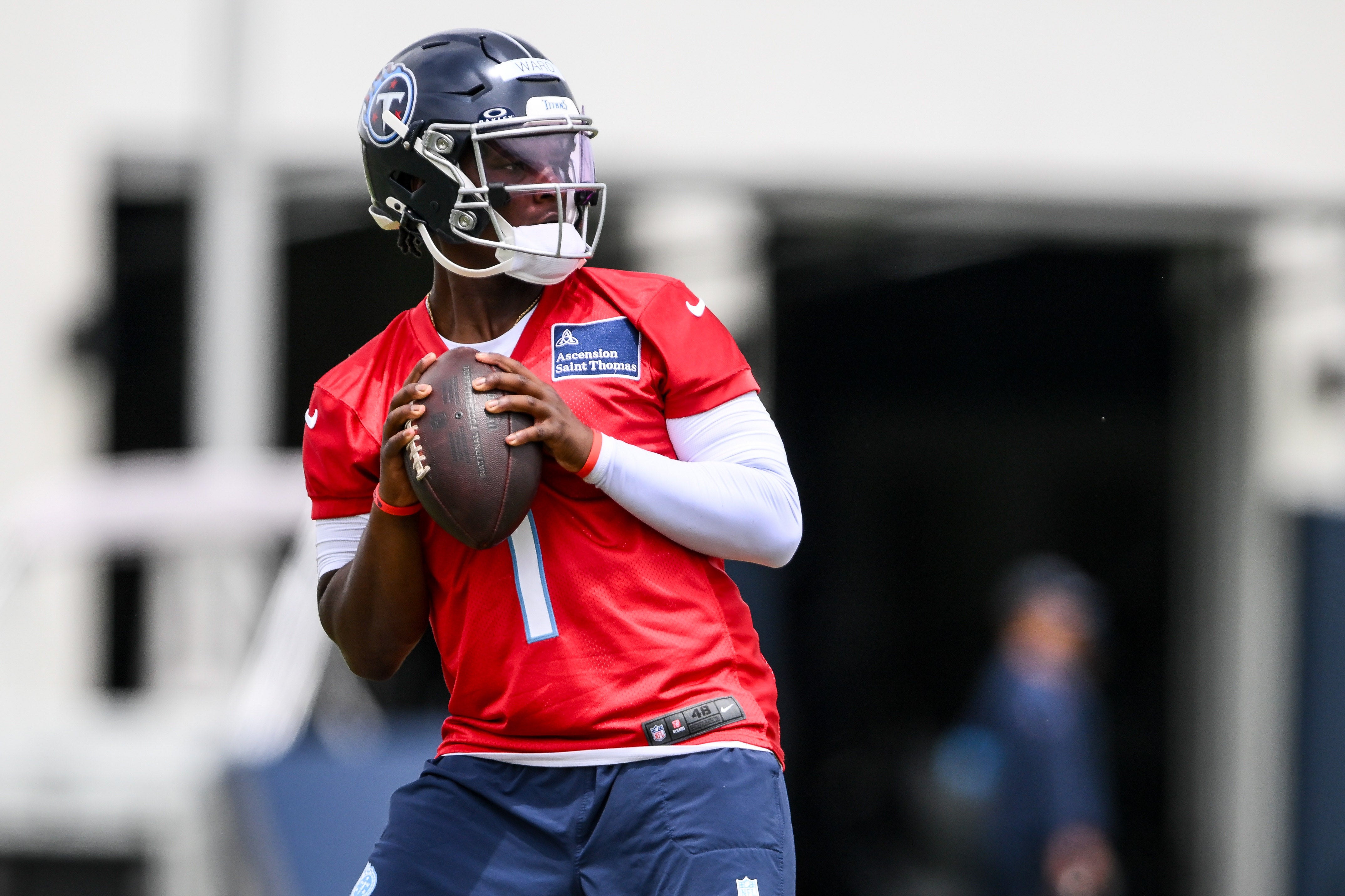 May 10, 2025; Nashville, TN, USA; Tennessee Titans quarterback Cam Ward (1) goes through throwing drills during Rookie Mini Camp at Saint Thomas Sports Park. Mandatory Credit: Steve Roberts-Imagn Images