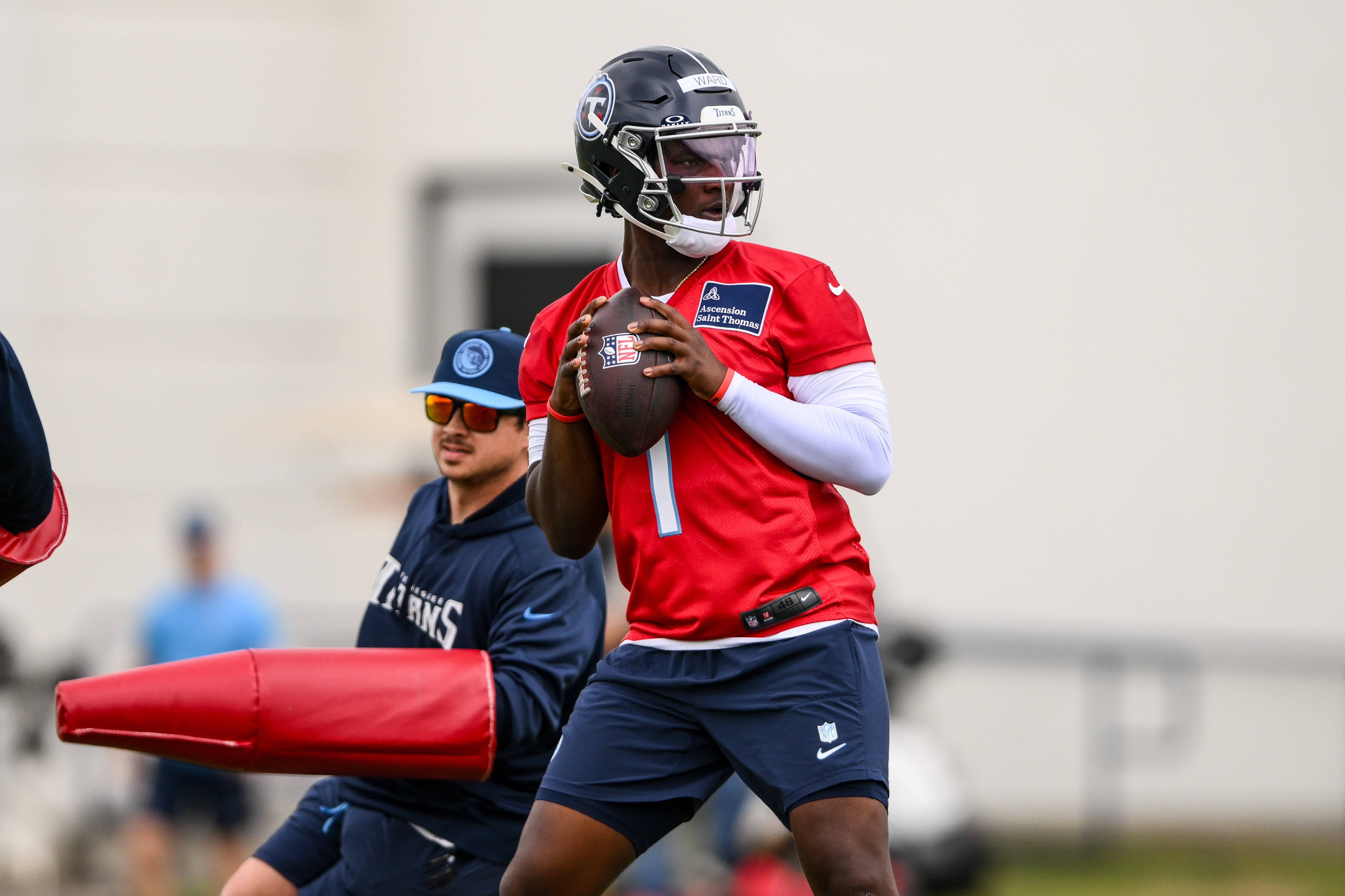 May 10, 2025; Nashville, TN, USA; Tennessee Titans quarterback Cam Ward (1) goes through drills during Rookie Mini Camp at Saint Thomas Sports Park. Mandatory Credit: Steve Roberts-Imagn Images