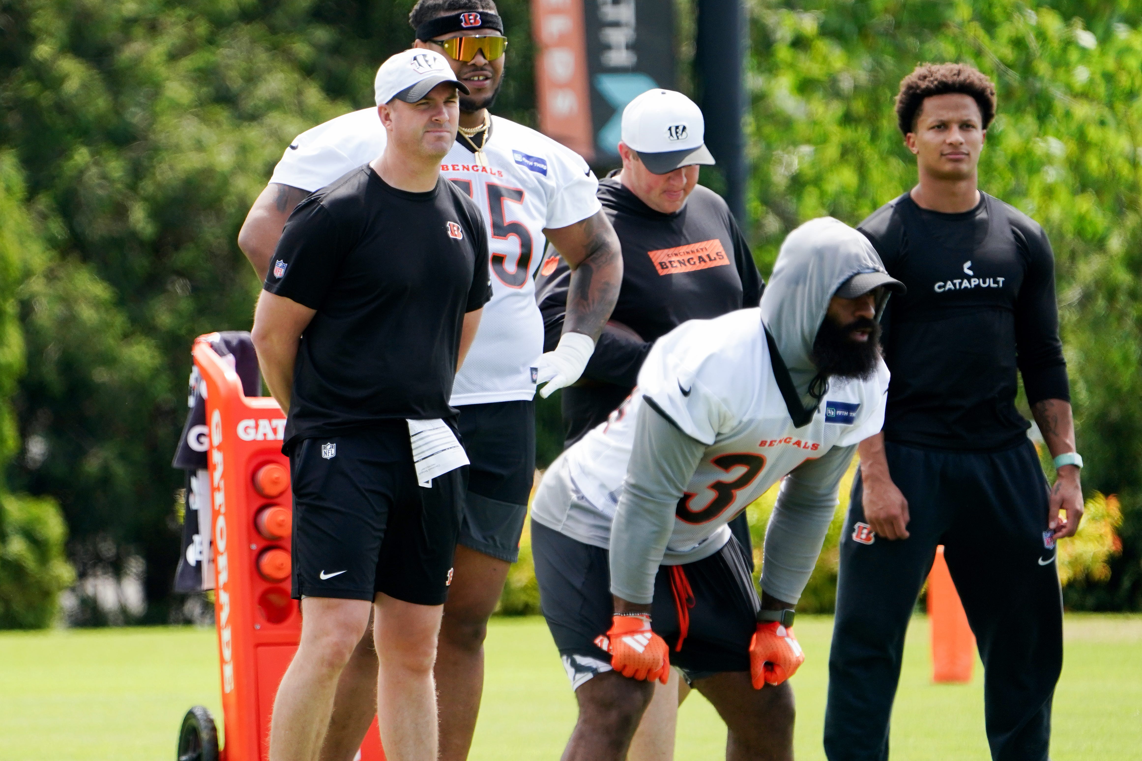 Cincinnati Bengals head coach Zac Taylor, far left, watches players practice, Tuesday, May 6, 2025, at the Kettering Health Practice Field in Downtown Cincinnati.