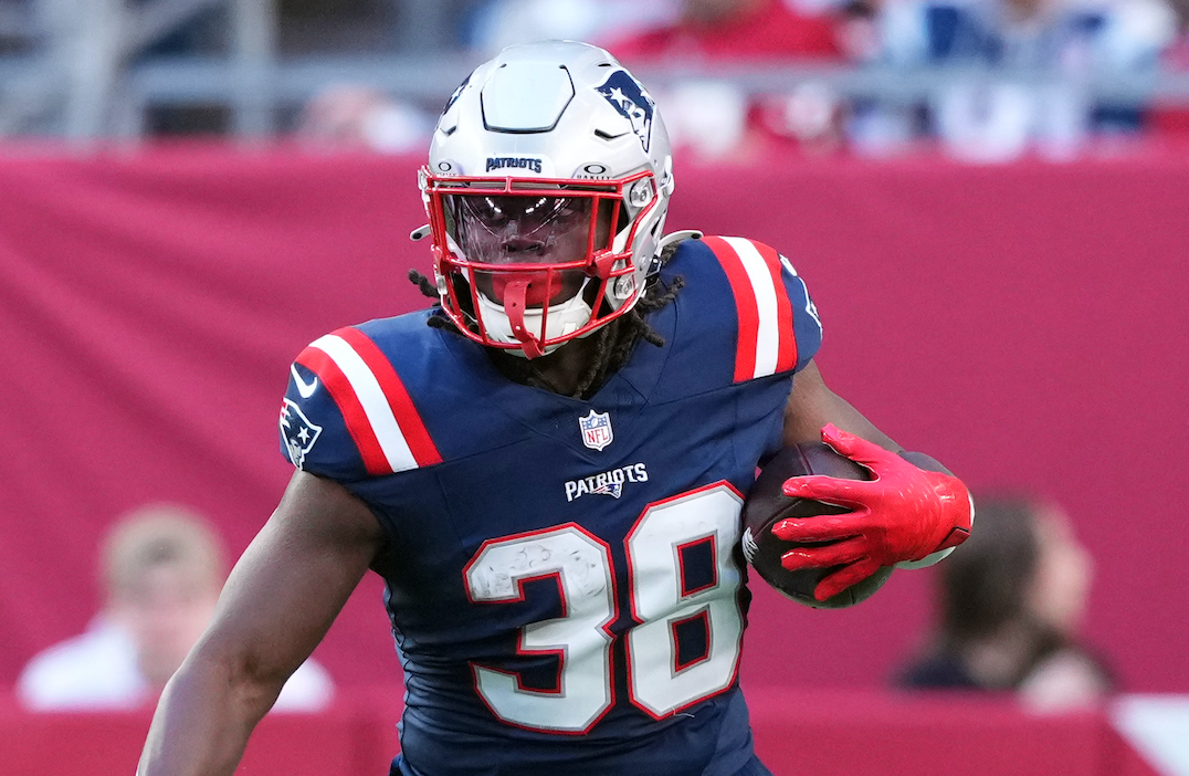 Dec 15, 2024; Glendale, Arizona, USA; New England Patriots running back Rhamondre Stevenson (38) runs against the Arizona Cardinals during the first half at State Farm Stadium.