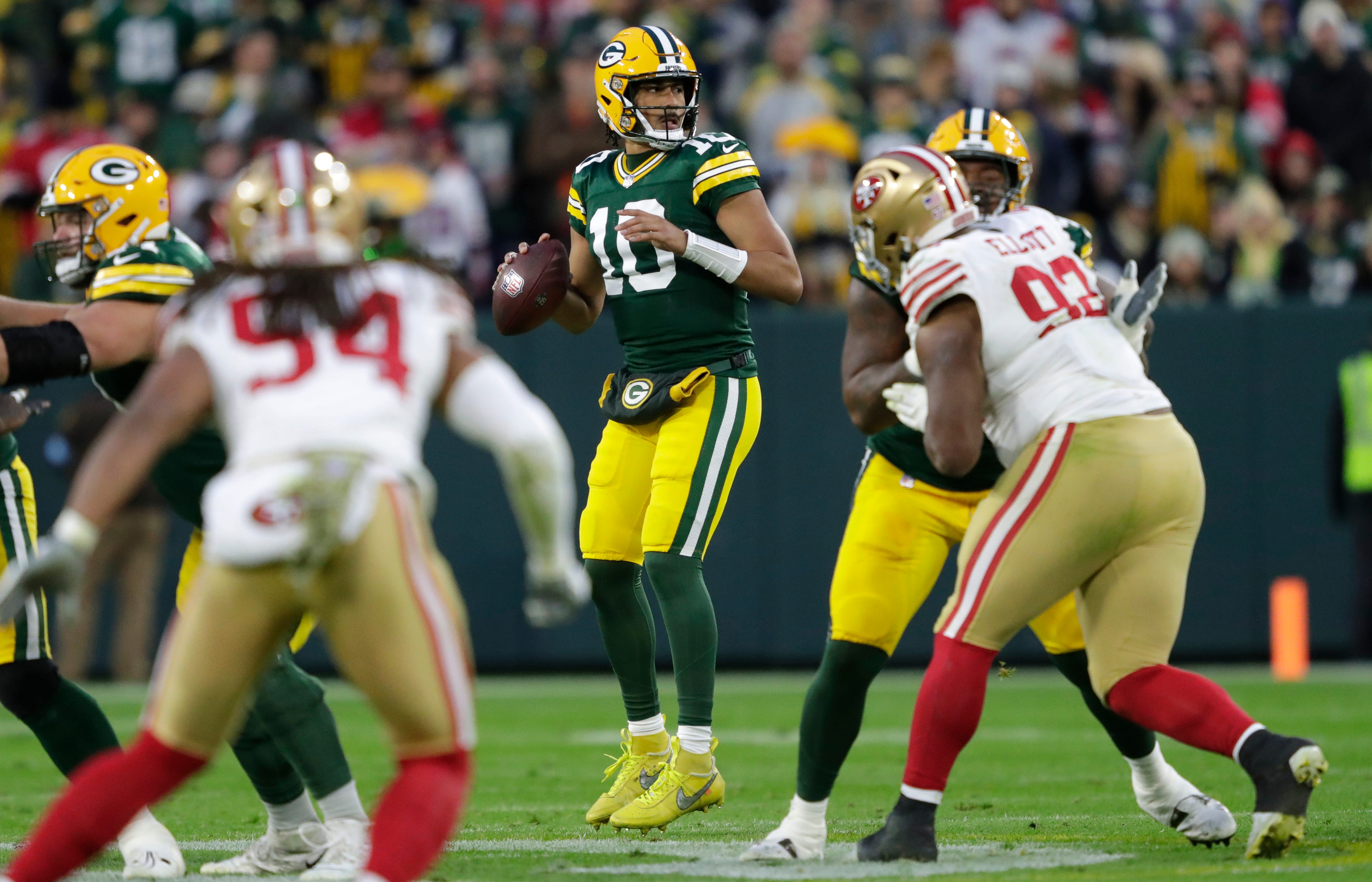 Green Bay Packers quarterback Jordan Love (10) looks to pass against the San Francisco 49ers during their football game Sunday, November 24, 2024, at Lambeau Field in Green Bay, Wisconsin.