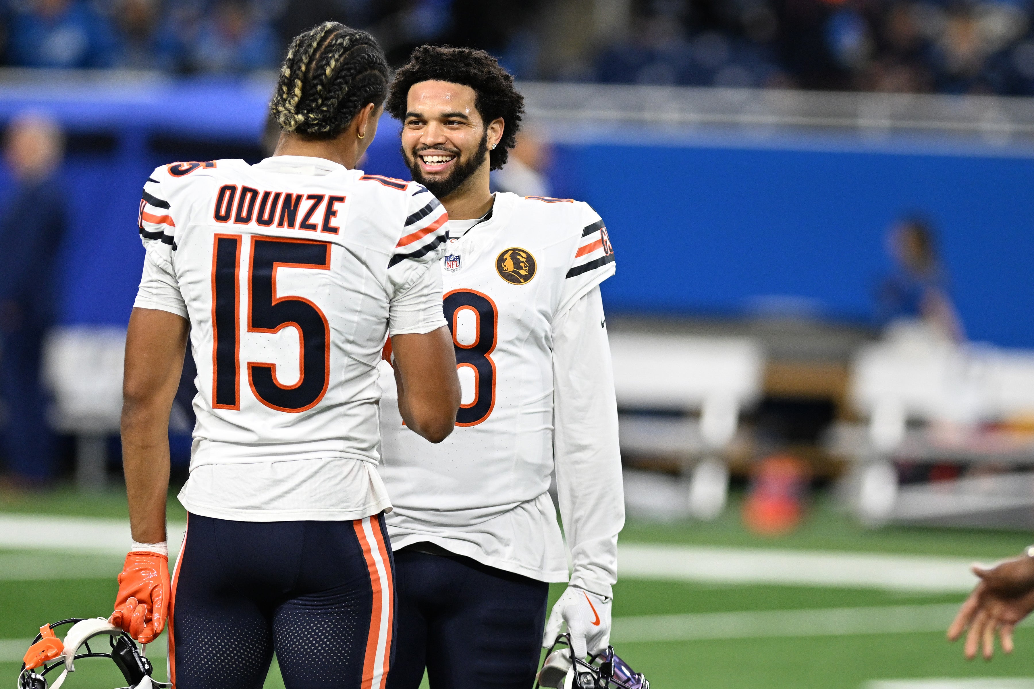 Nov 28, 2024; Detroit, Michigan, USA; Chicago Bears quarterback Caleb Williams (18) greets wide receiver Rome Odunze (15) during pregame warmups before their game against the Detroit Lions at Ford Field.