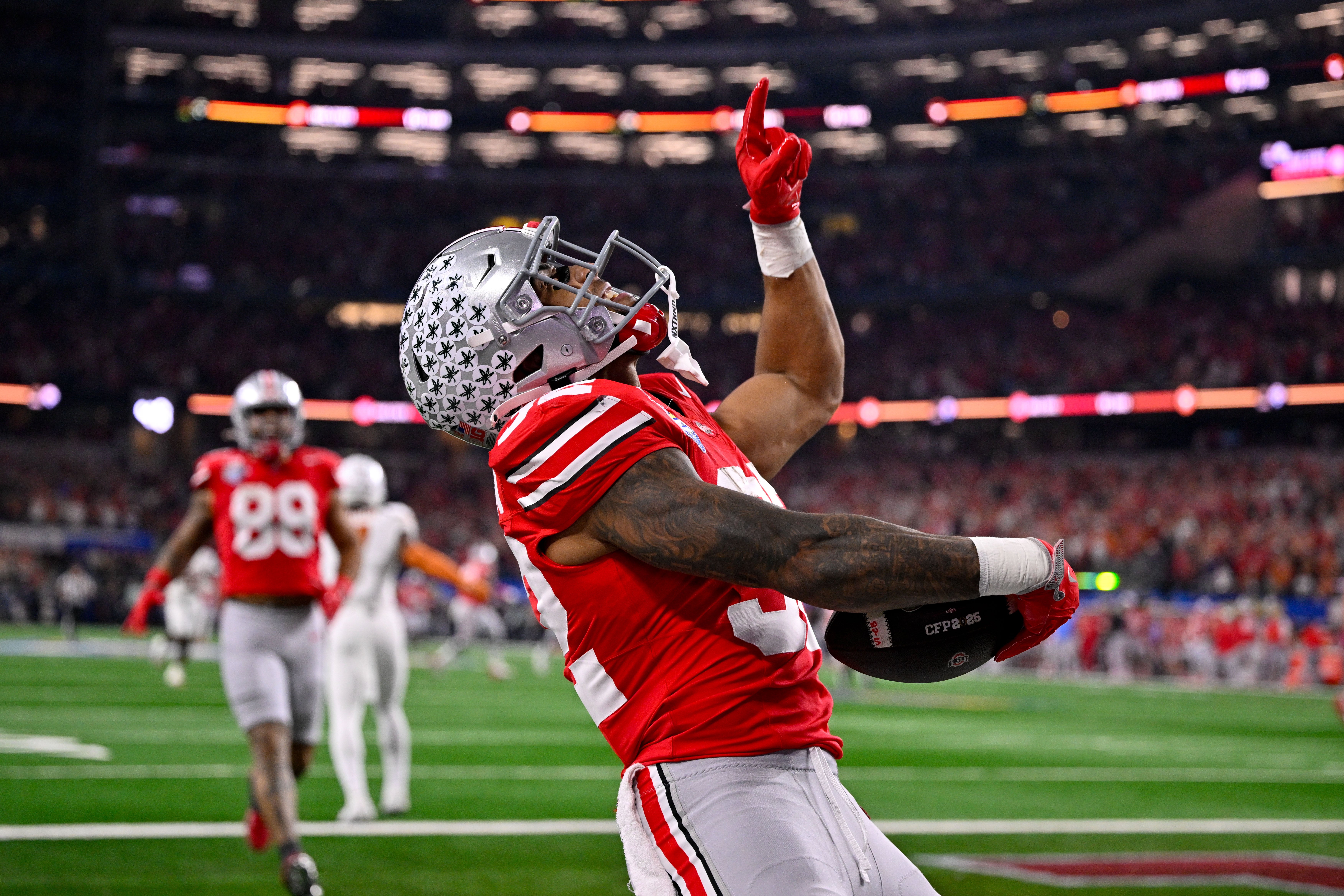 Jan 10, 2025; Arlington, TX, USA; Ohio State Buckeyes running back TreVeyon Henderson (32) celebrates during the game between the Texas Longhorns and the Ohio State Buckeyes at AT&T Stadium.