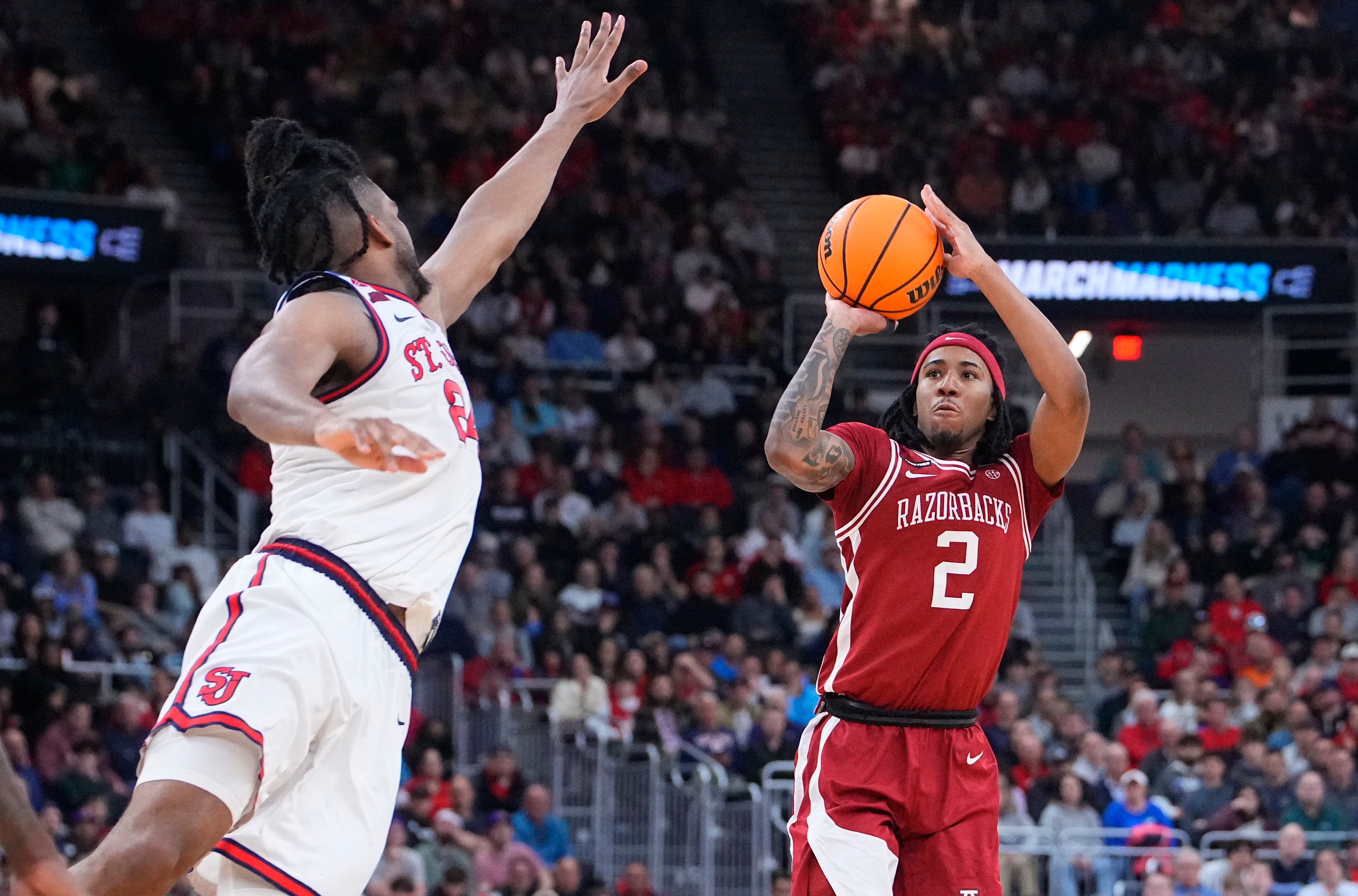 Mar 22, 2025; Providence, RI, USA; Arkansas Razorbacks guard Boogie Fland (2) shoots against St. John's Red Storm forward Zuby Ejiofor (24) during the second half of a second round men’s NCAA Tournament game at Amica Mutual Pavilion.