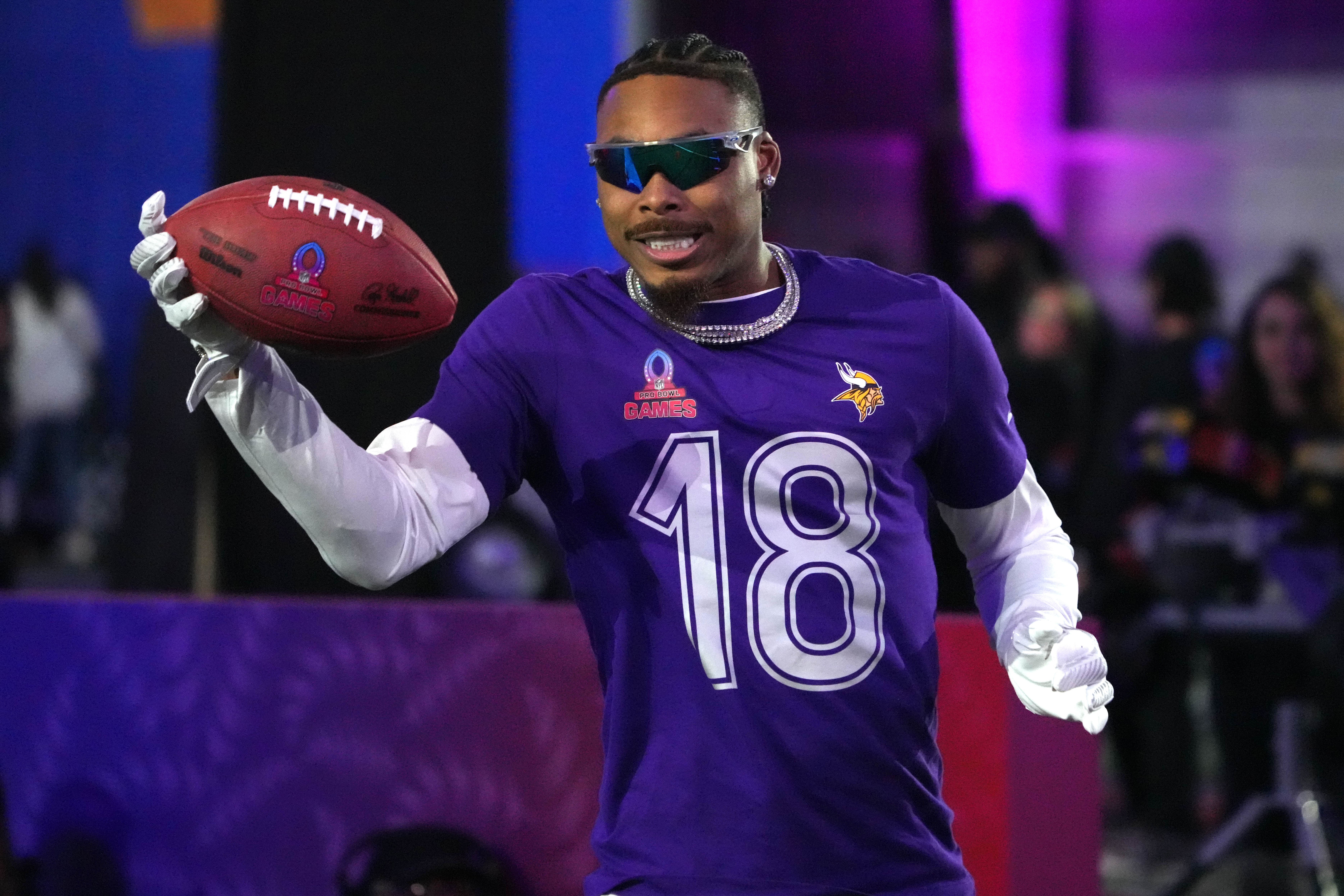 Jan 30, 2025; Orlando, FL, USA; NFC wide receiver Justin Jefferson of the Minnesota Vikings (18) catches the ball during the Satisfying Catch event at the Pro Bowl Skills Challenge at Nicholson Fieldhouse.