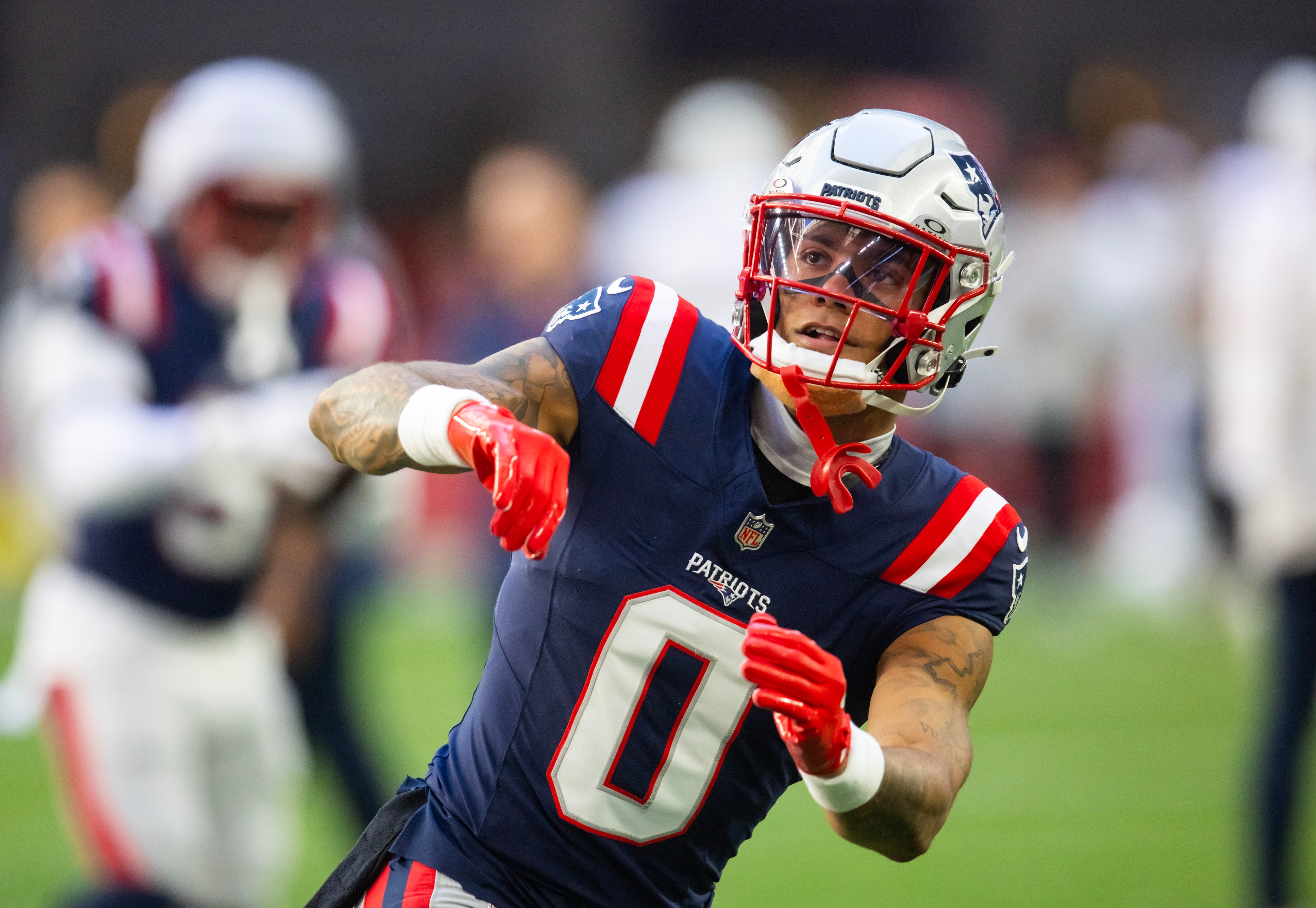 Dec 15, 2024; Glendale, Arizona, USA; New England Patriots cornerback Christian Gonzalez (0) against the Arizona Cardinals at State Farm Stadium