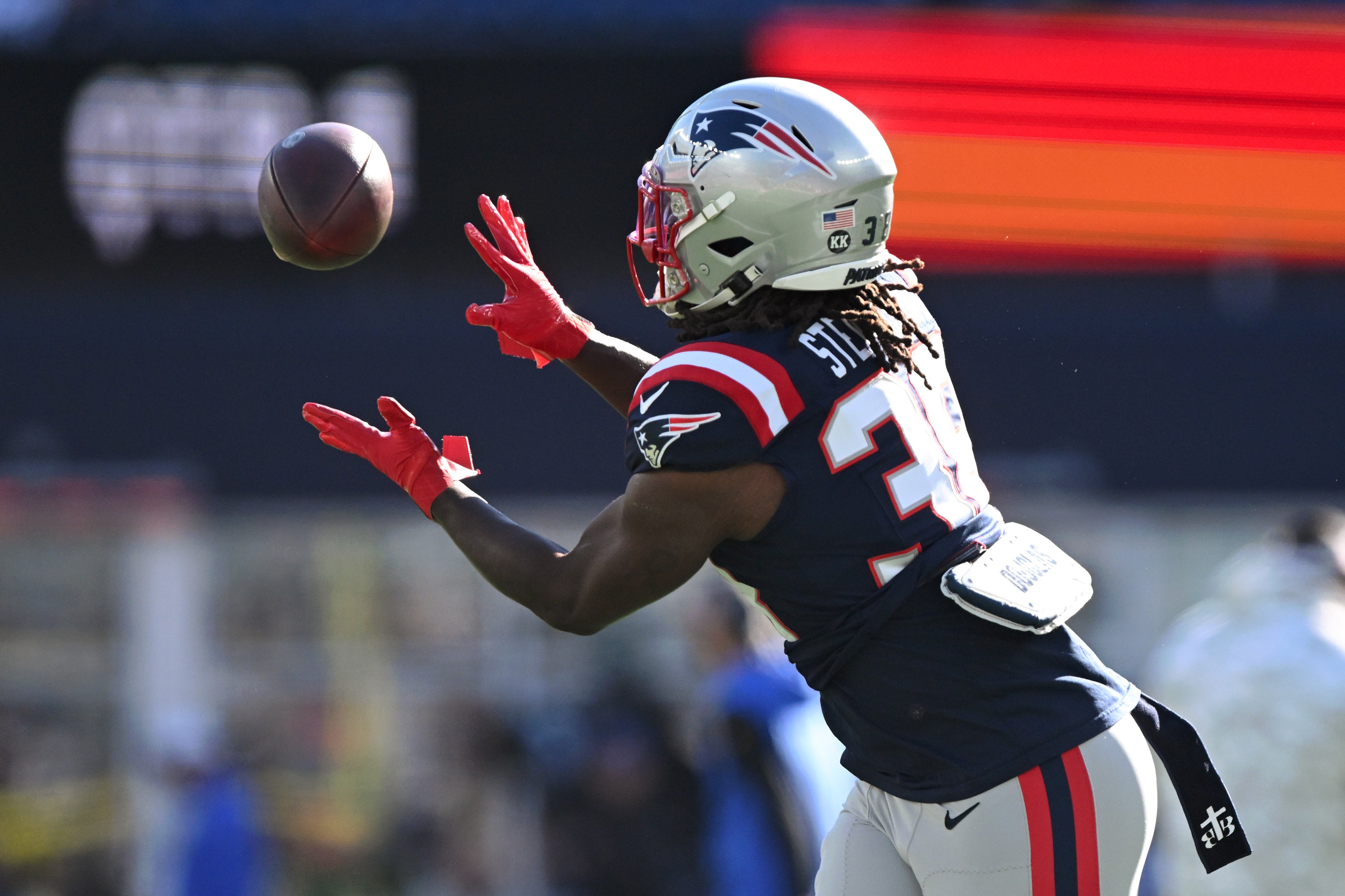 Nov 17, 2024; Foxborough, Massachusetts, USA; New England Patriots running back Rhamondre Stevenson (38) makes a catch before a game against the Los Angeles Rams at Gillette Stadium.