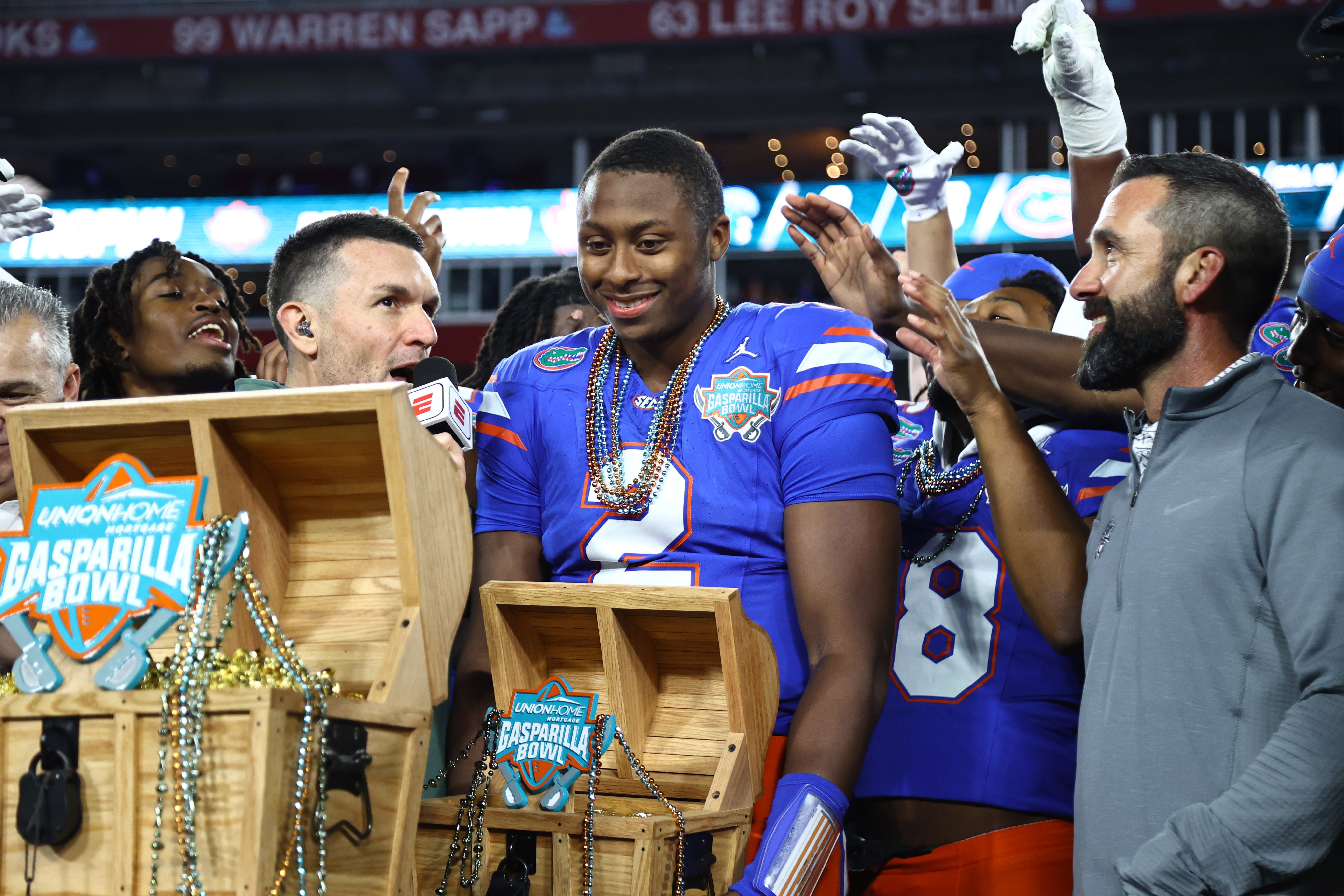Dec 20, 2024; Tampa, FL, USA; Florida Gators quarterback DJ Lagway (2) is presented the MVP trophy after the win against the Tulane Green Wave at Raymond James Stadium.