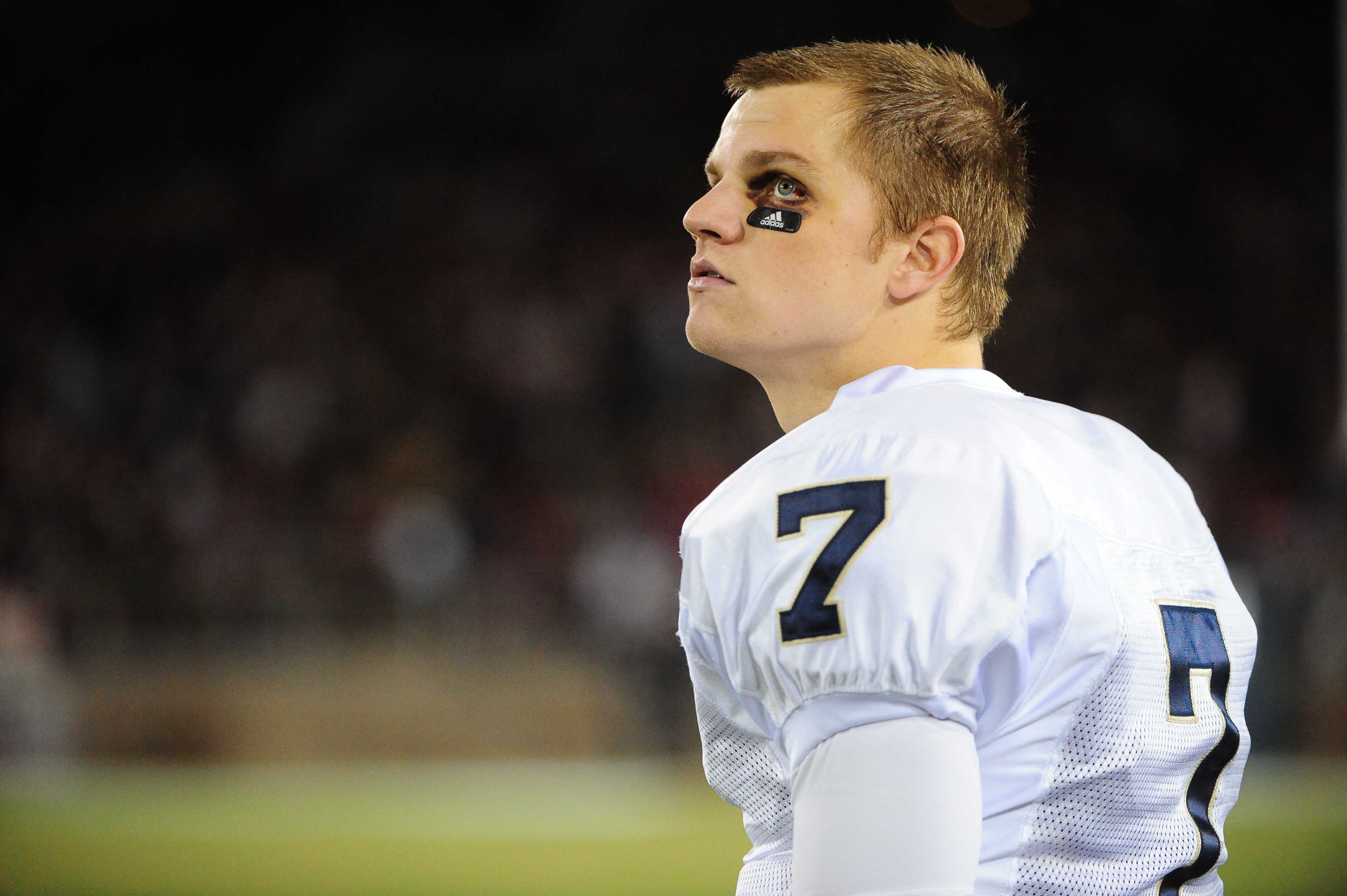 November 28, 2009; Stanford, CA, USA; Notre Dame Fighting Irish quarterback Jimmy Clausen (7) watches from the sidelines during the second quarter against the Stanford Cardinal at Stanford Stadium. The Fighting Irish defeated the Cardinal 45-38. Mandatory Credit: Kyle Terada-Imagn Images  