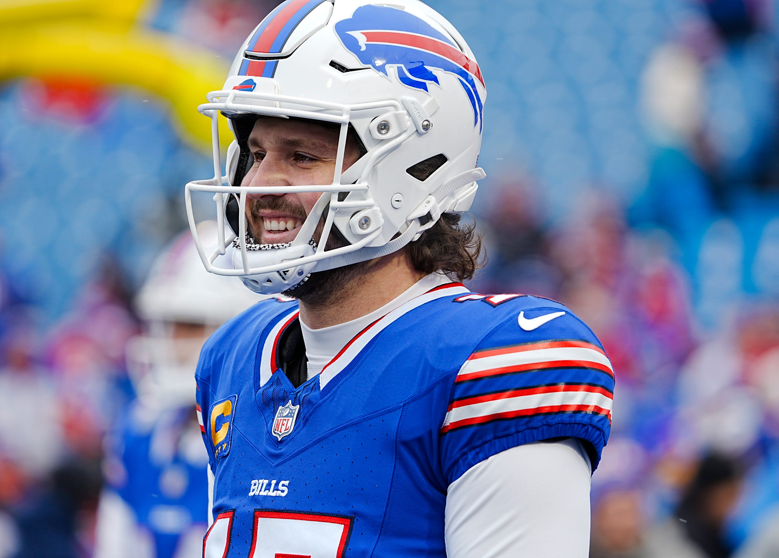 Buffalo Bills quarterback Josh Allen (17) smiles while warming up before the Buffalo Bills wild card game against the Denver Broncos at Highmark Stadium in Orchard Park on Jan. 12, 2025.