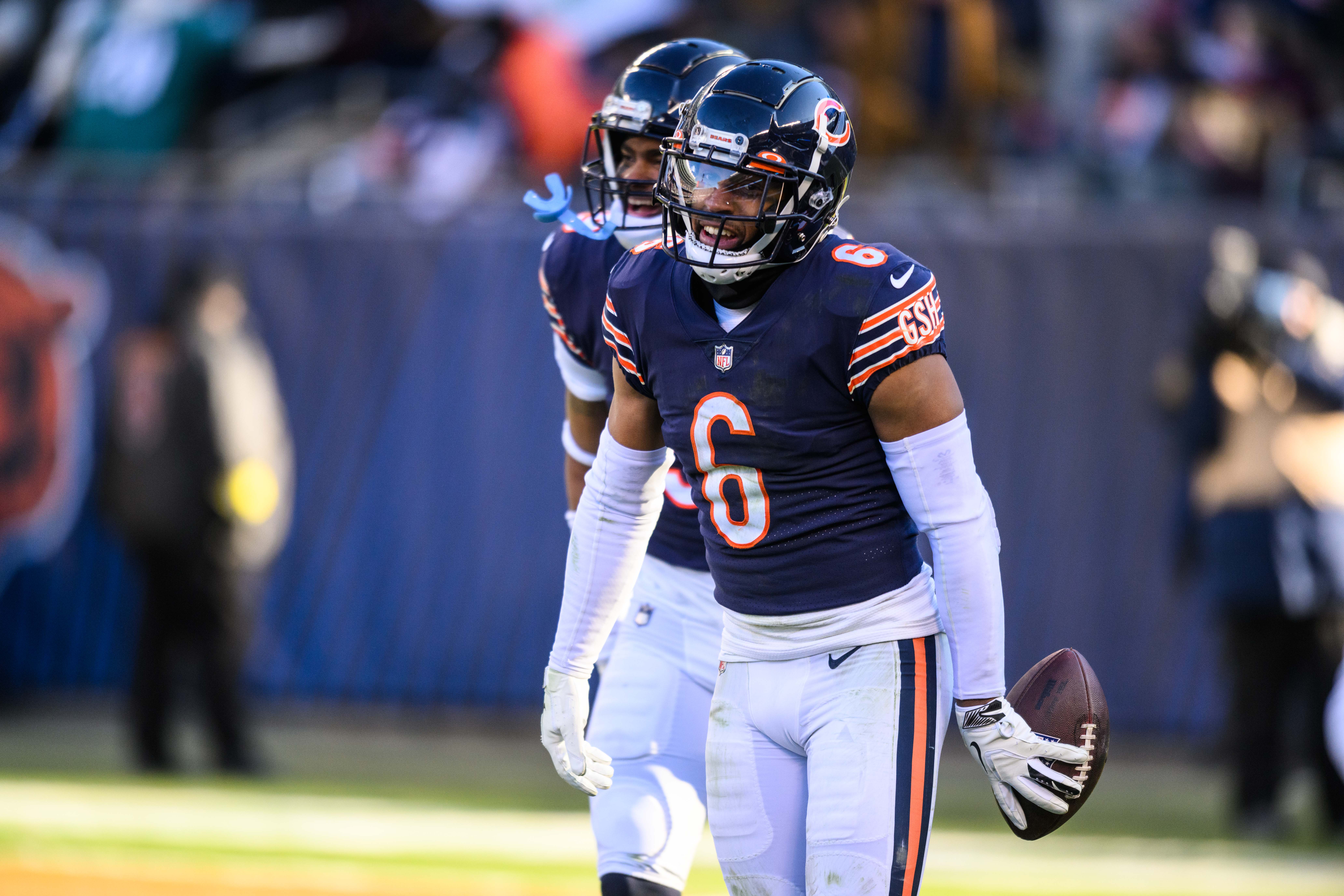 Dec 18, 2022; Chicago, Illinois, USA; Chicago Bears cornerback Kyler Gordon (6) celebrates his fumble recovery in the first quarter against the Philadelphia Eagles at Soldier Field.