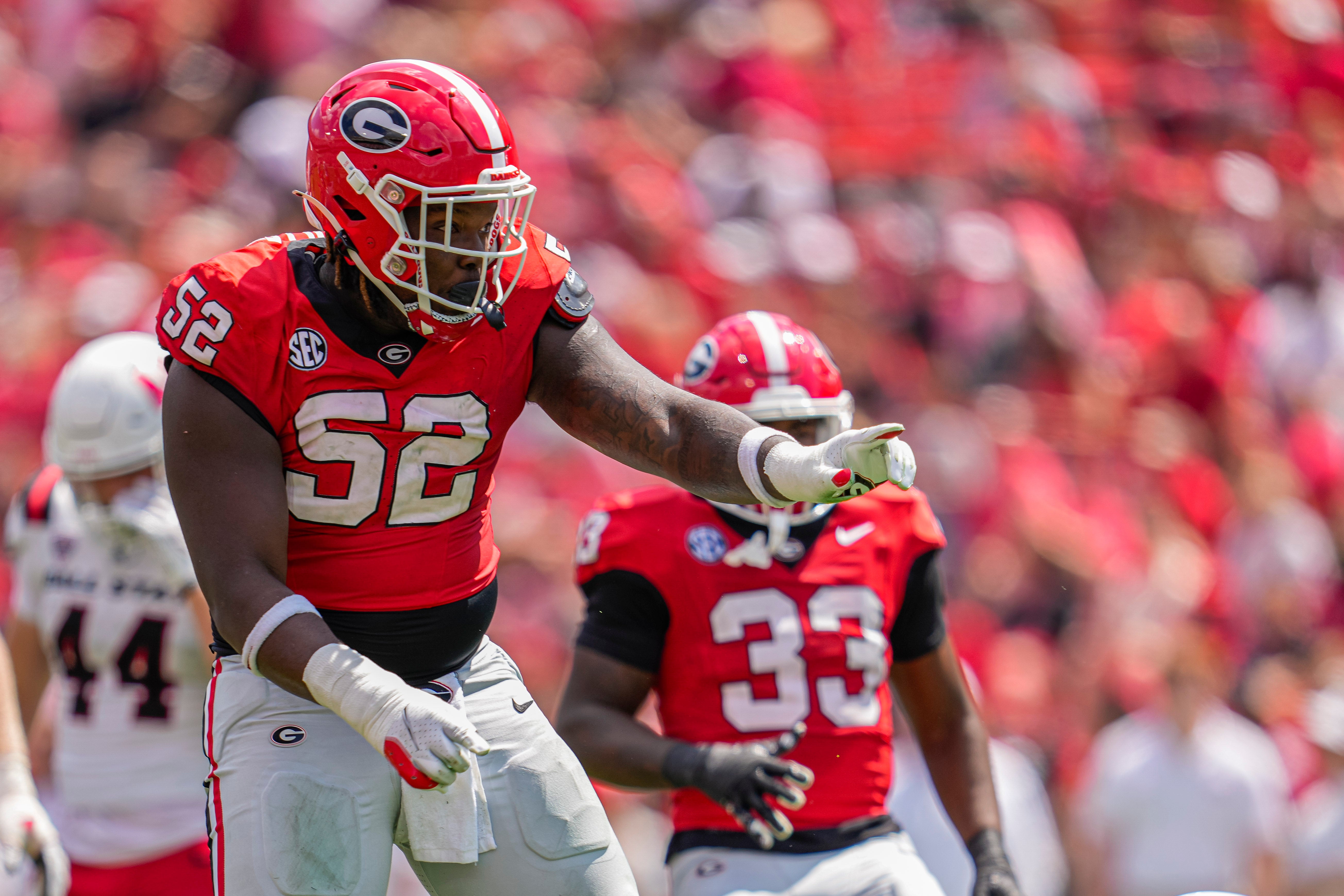 Sep 9, 2023; Athens, Georgia, USA; Georgia Bulldogs defensive lineman Christen Miller (52) reacts after making a tackle against the Ball State Cardinals during the second half at Sanford Stadium.