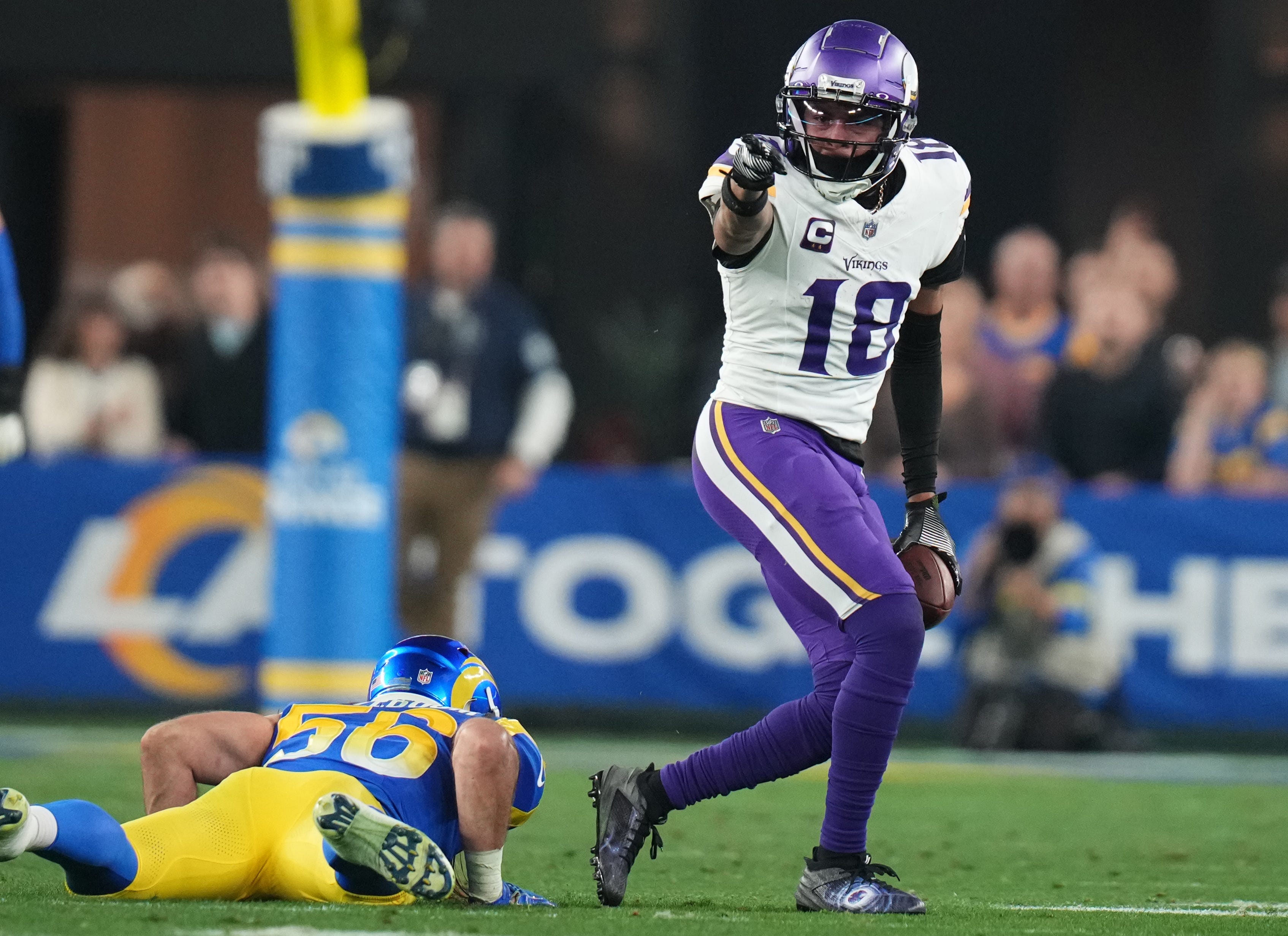 Minnesota Vikings receiver Justin Jefferson (18) signals a first down after a catch against the Los Angeles Rams during their playoff game at State Farm Stadium on Jan. 13, 2025, in Glendale.