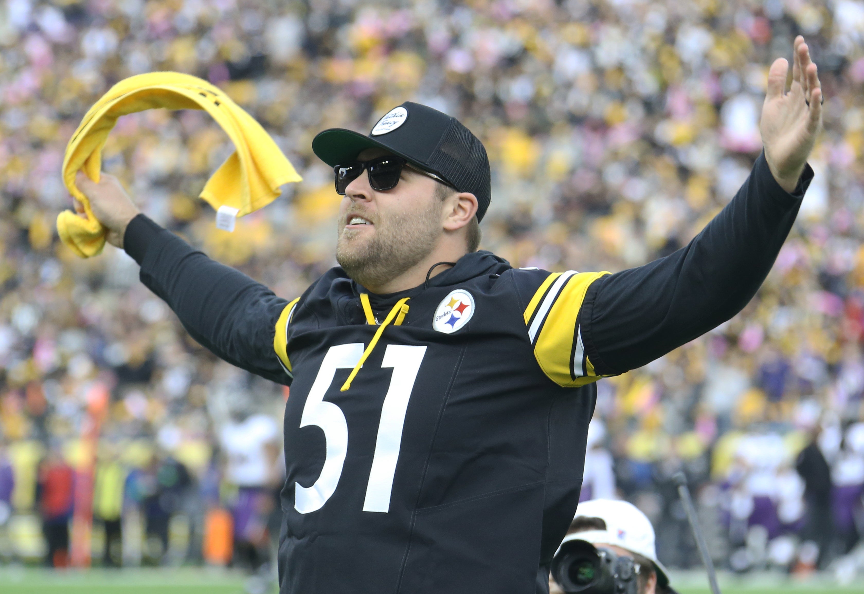 Oct 8, 2023; Pittsburgh, Pennsylvania, USA; Pittsburgh Pirates relief pitcher David Bednar (51) leads the Terrible Towel wave before the Pittsburgh Steelers host the Baltimore Ravens at Acrisure Stadium.