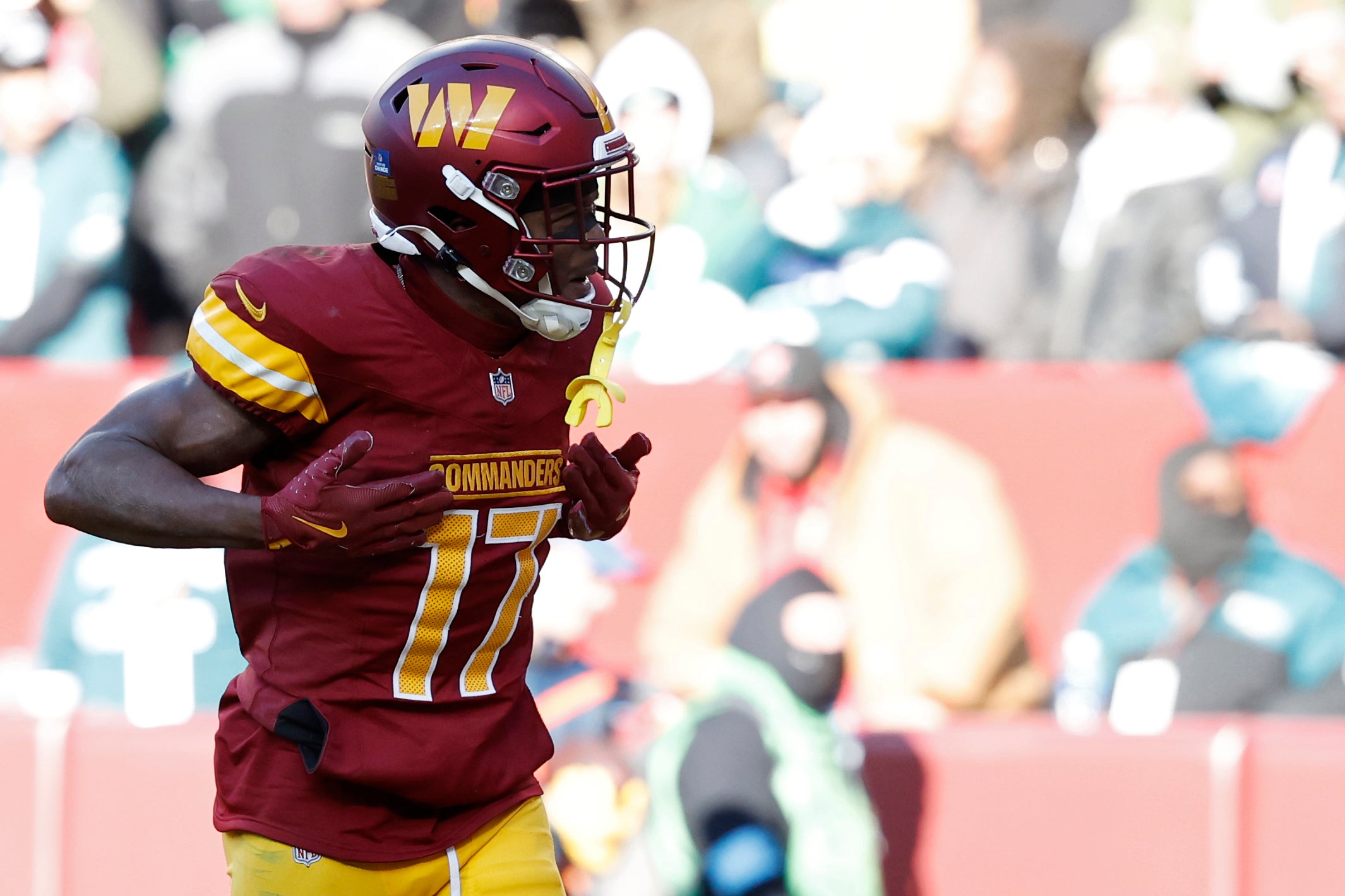 Dec 22, 2024; Landover, Maryland, USA; Washington Commanders wide receiver Terry McLaurin (17) celebrates after catching a touchdown pass against the Philadelphia Eagles during the second quarter at Northwest Stadium.