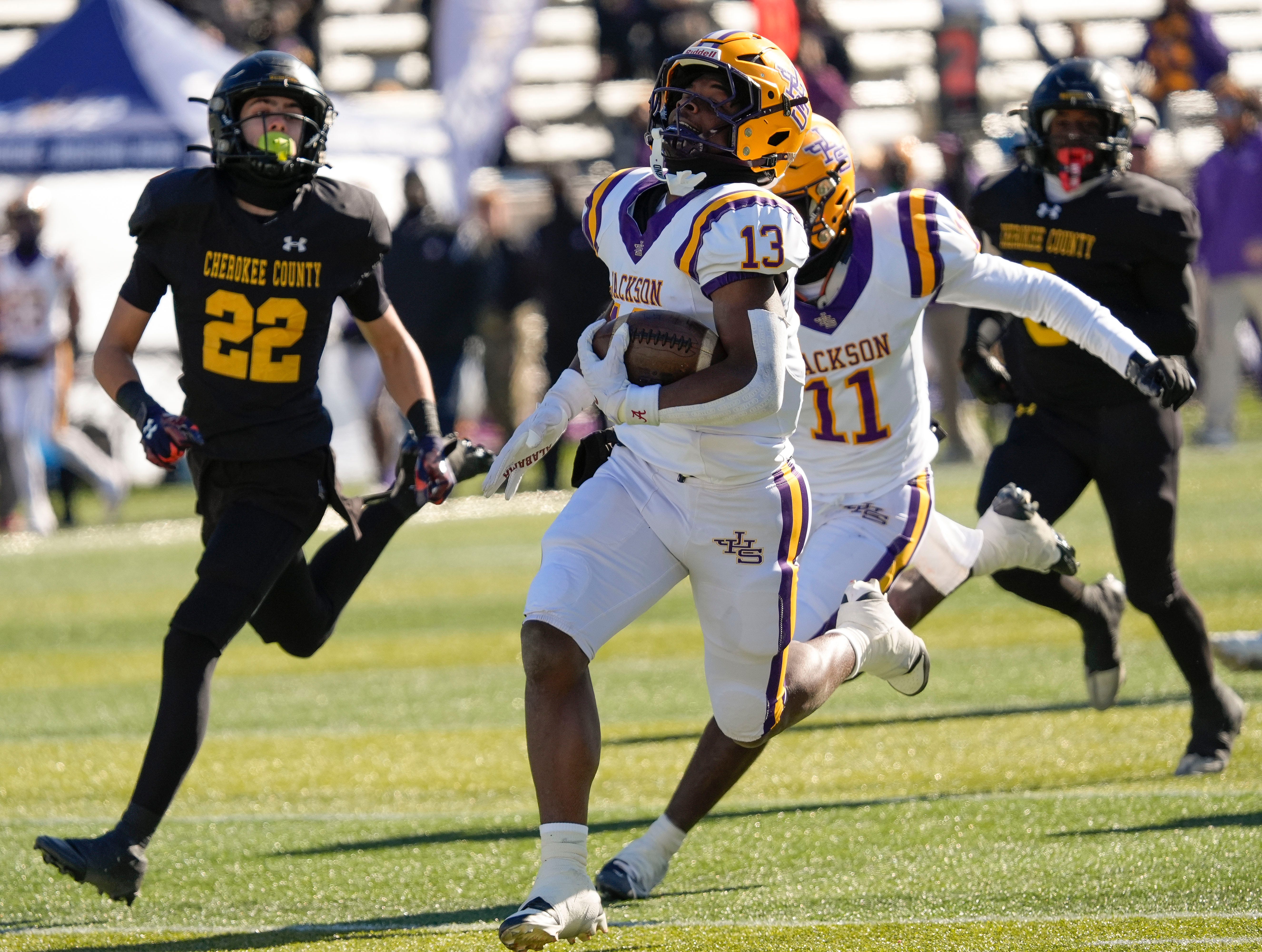 Dec 6, 2024; Birmingham, AL, USA; Jackson's Ezavier Crowell (13) breaks a long touchdown run on the Aggie’s first possession against Cherokee County at Protective Stadium in the AHSAA 4A State Championship game.