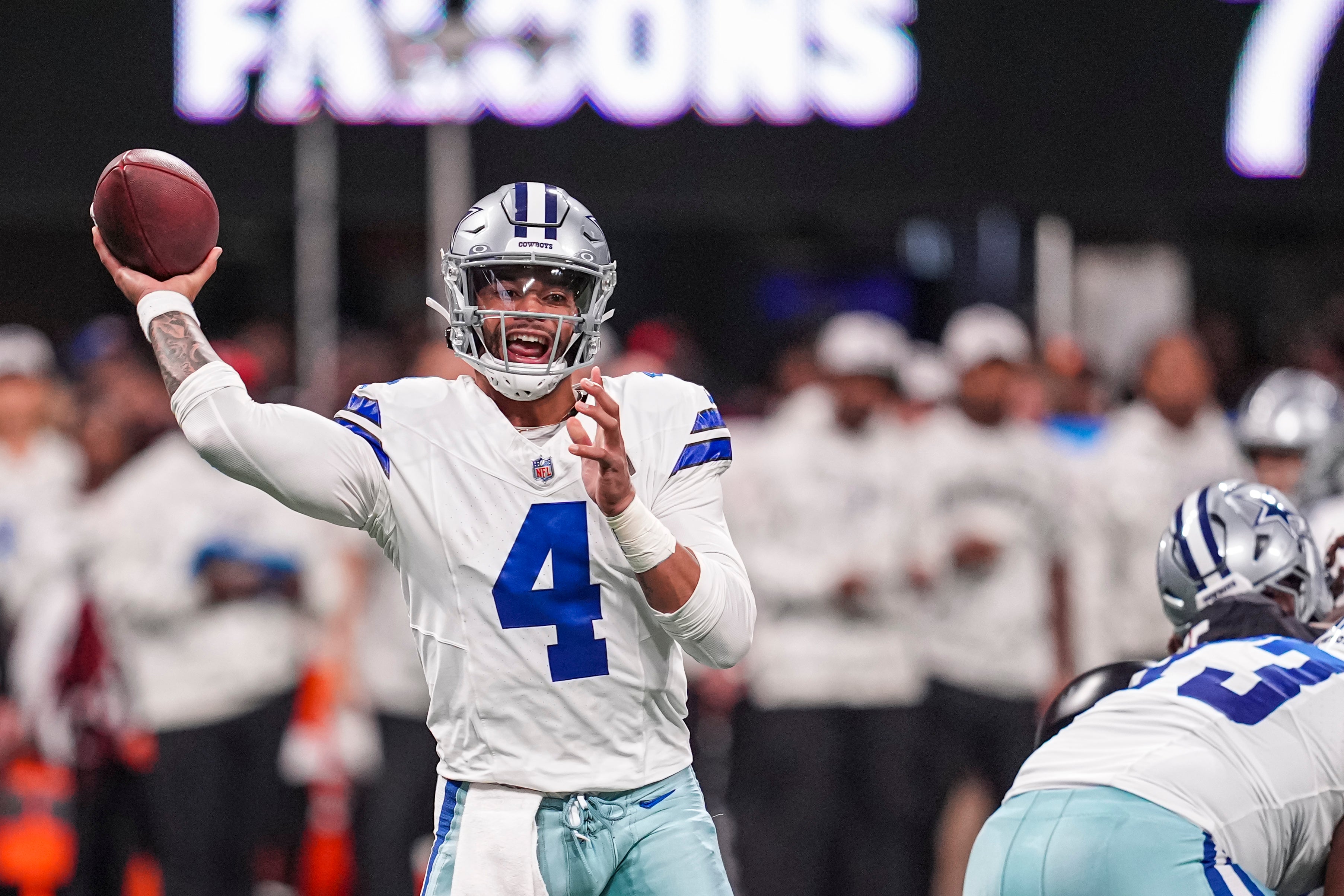 Dallas Cowboys quarterback Dak Prescott (4) throws a pass against the Atlanta Falcons during the second half at Mercedes-Benz Stadium.