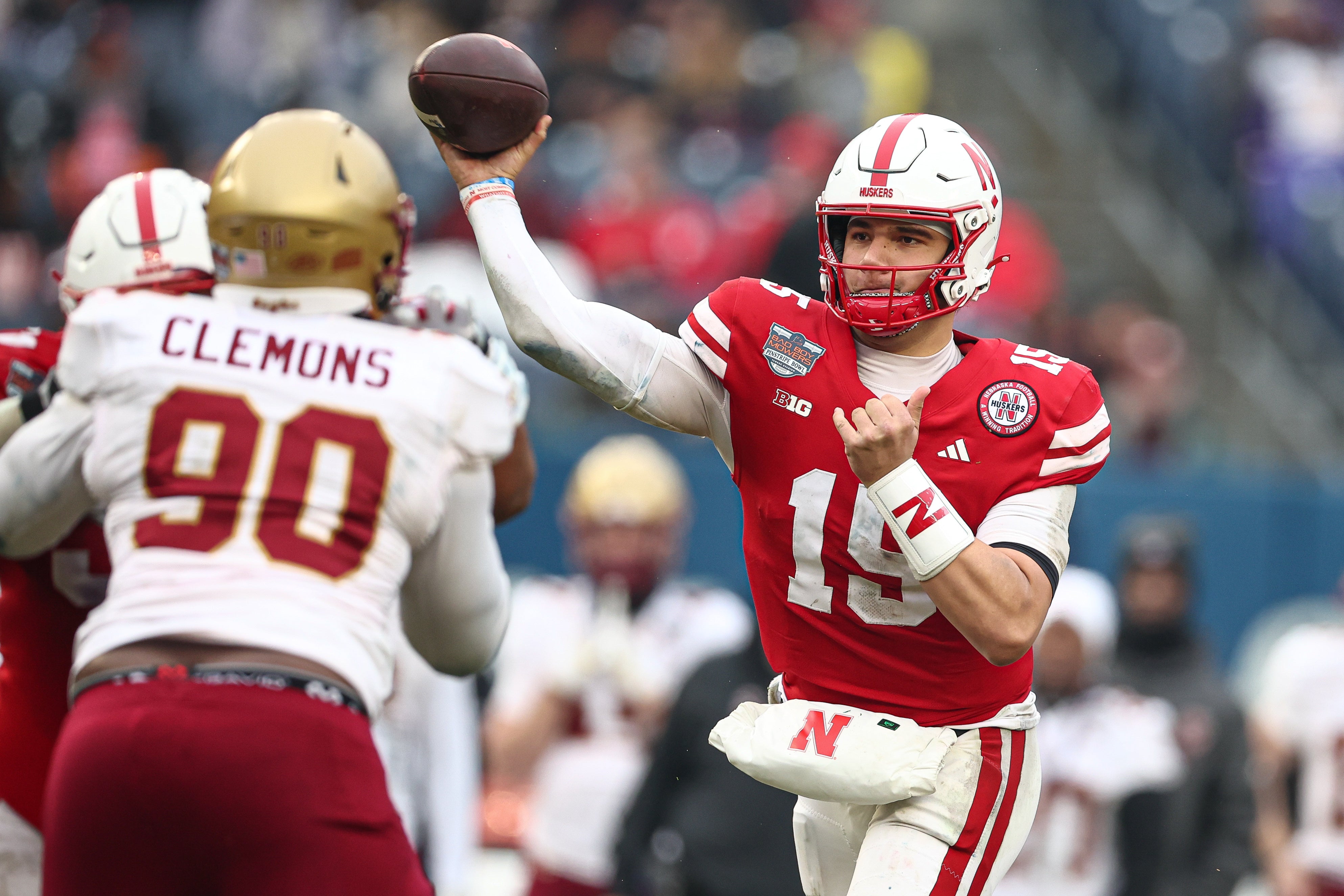Dec 28, 2024; Bronx, NY, USA; Nebraska Cornhuskers quarterback Dylan Raiola (15) throws the ball during the second half against the Boston College Eagles at Yankee Stadium. Mandatory Credit: Vincent Carchietta-Imagn Images