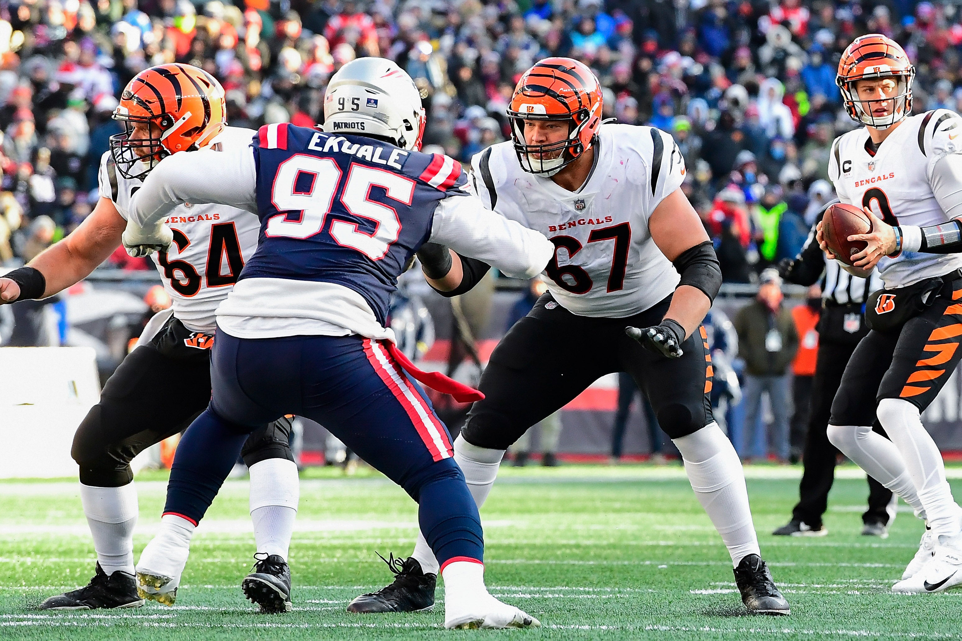 Dec 24, 2022; Foxborough, Massachusetts, USA; Cincinnati Bengals offensive tackle Cordell Volson (67) blocks New England Patriots defensive tackle Daniel Ekuale (95) during the first half at Gillette Stadium.