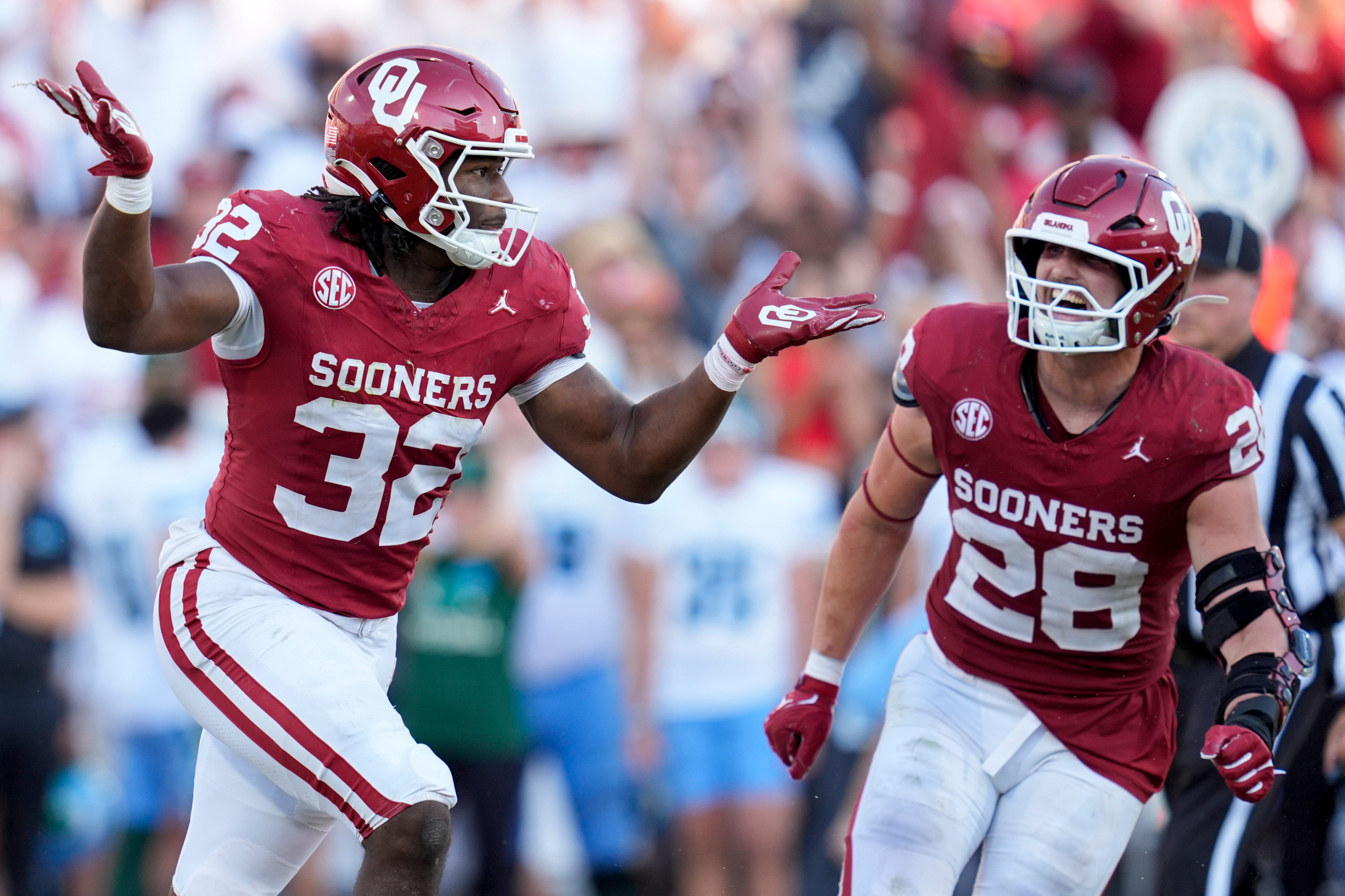 Oklahoma Sooners defensive lineman R Mason Thomas (32) celebrates beside Oklahoma Sooners linebacker Danny Stutsman (28) after a sacks during a college football game between the University of Oklahoma Sooners (OU) and the Tulane Green Wave at Gaylord Family - Oklahoma Memorial Stadium in Norman, Okla., Saturday, Sept. 14, 2024.