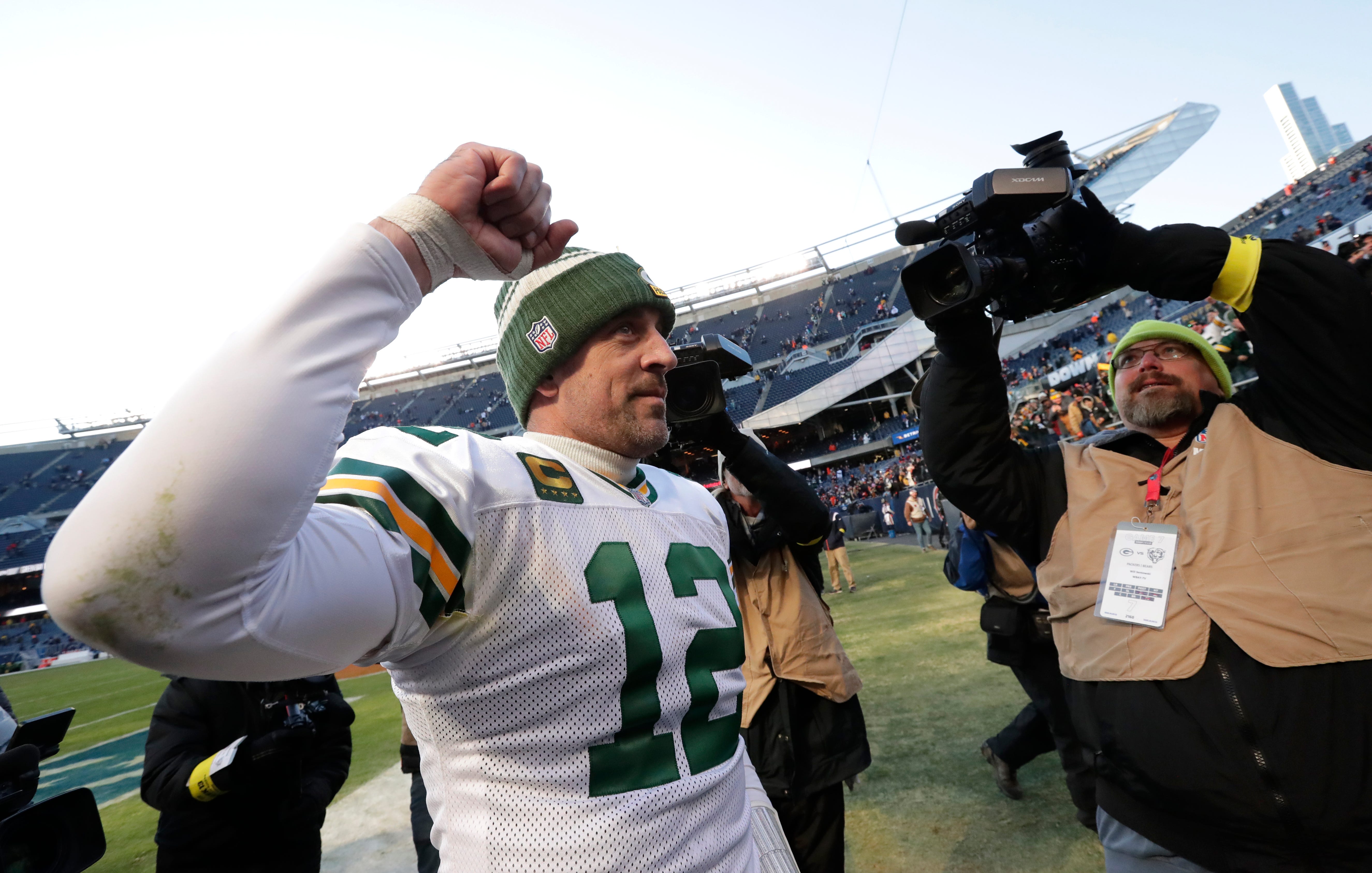 Green Bay Packers quarterback Aaron Rodgers (12) acknowledges the crowd as he celebrates defeating the Chicago Bears during their football game Sunday, December 4, at Soldier Field in Chicago