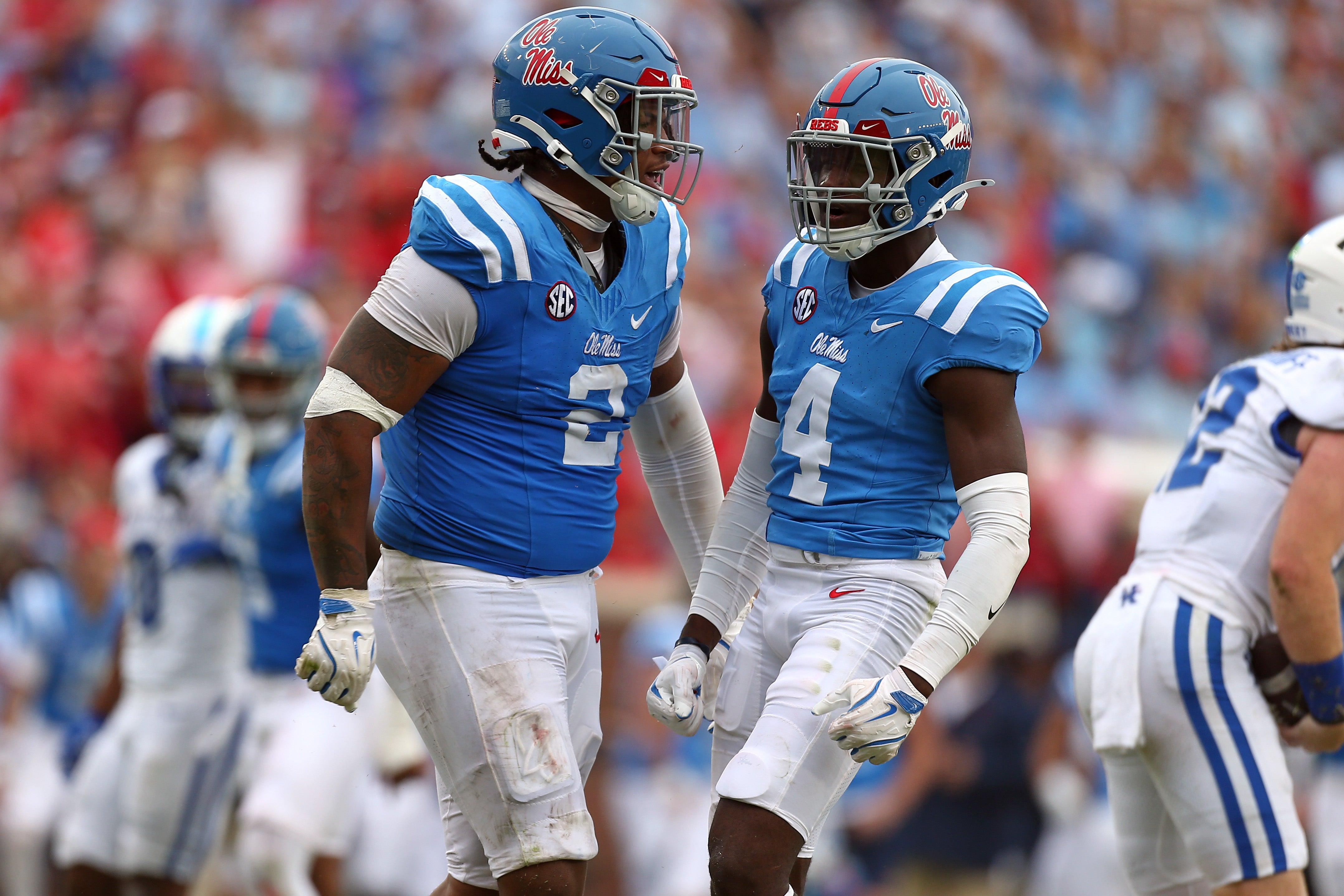 Sep 28, 2024; Oxford, Mississippi, USA; Mississippi Rebels defensive linemen Walter Nolen (2) and linebacker Suntarine Perkins (4) react after a sack during the second half against the Kentucky Wildcats at Vaught-Hemingway Stadium.