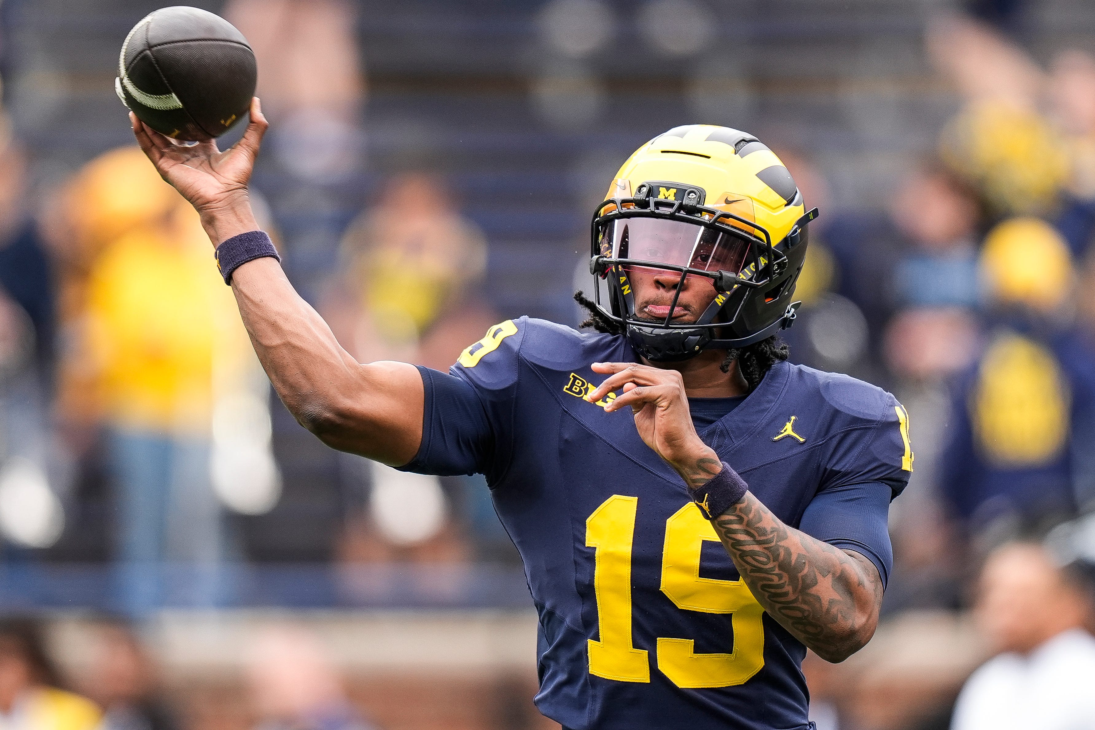 Michigan quarterback Bryce Underwood (19) throws at warm up before the spring game at Michigan Stadium in Ann Arbor on Saturday, April 19, 2025.
