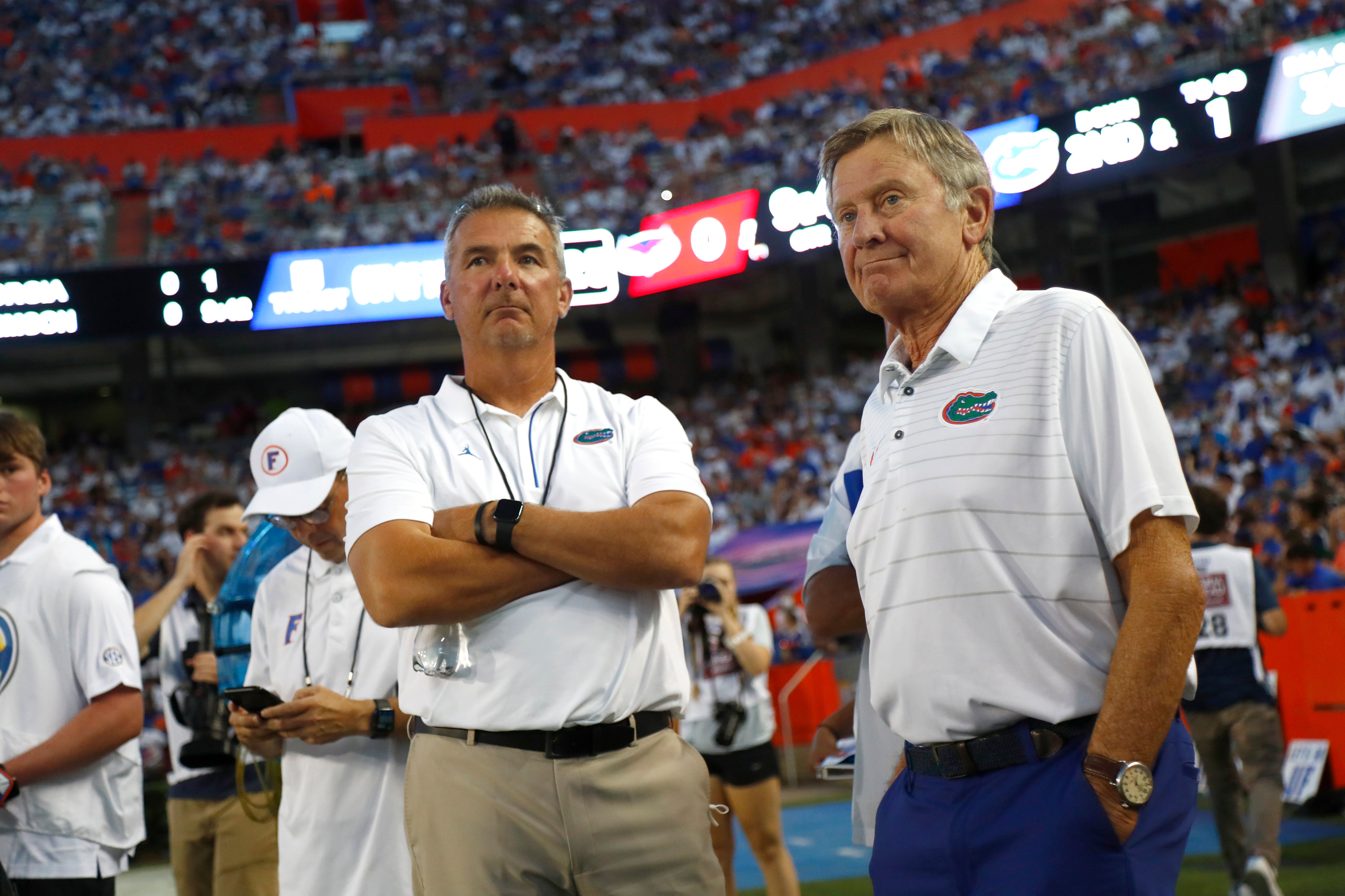 Sep 4, 2021; Gainesville, Florida, USA; Florida Gators former head coach Urban Meyer and Steve Spurrier on the sidelines during the first quarter against the Florida Atlantic Owls at Ben Hill Griffin Stadium.