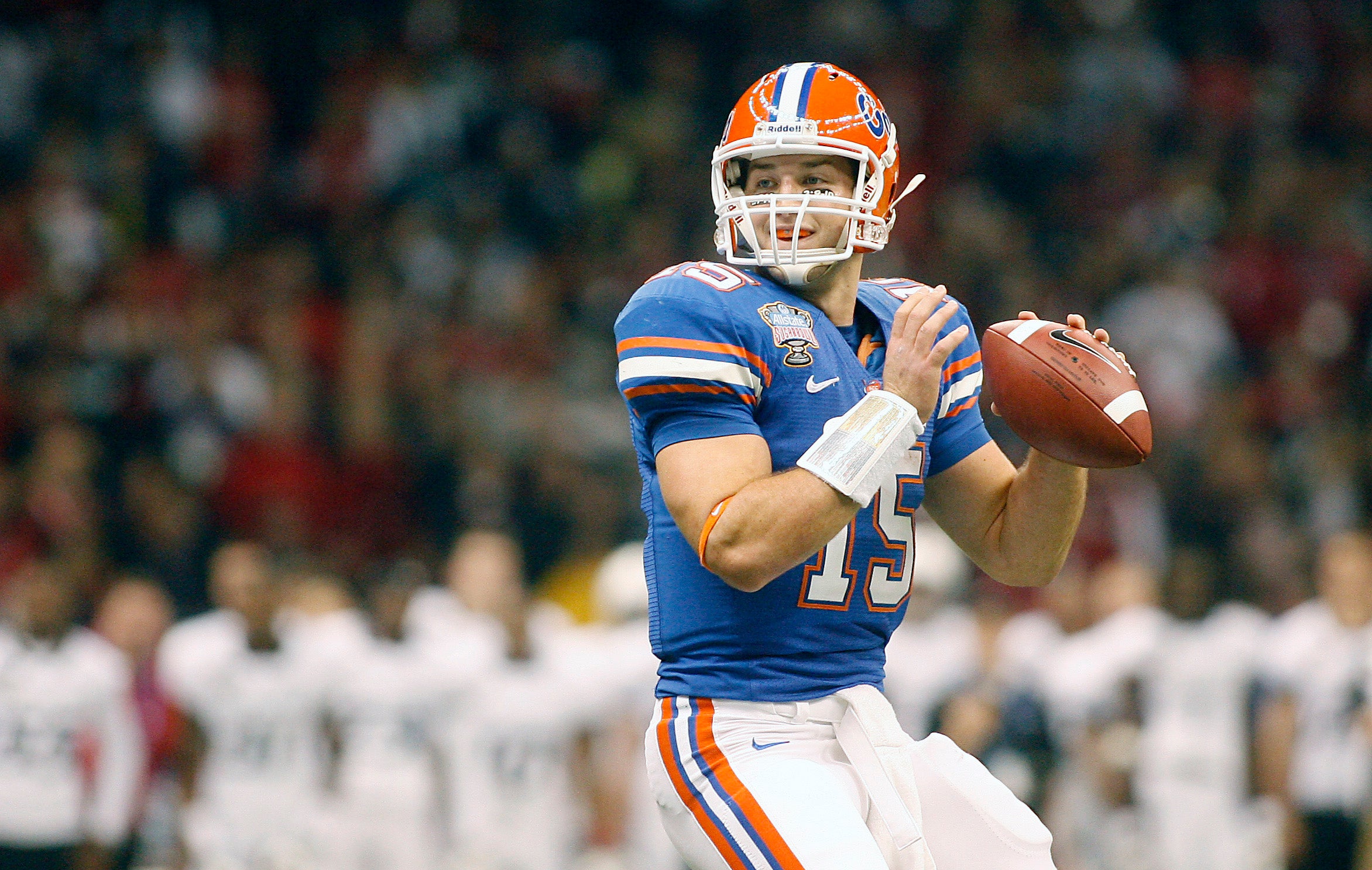 Jan 01, 2010; New Orleans, LA, USA; Florida Gators quarterback Tim Tebow (15) goes back for a pass against the Cincinnati Bearcats during the first half of the 2010 Sugar Bowl at the Louisiana Superdome.