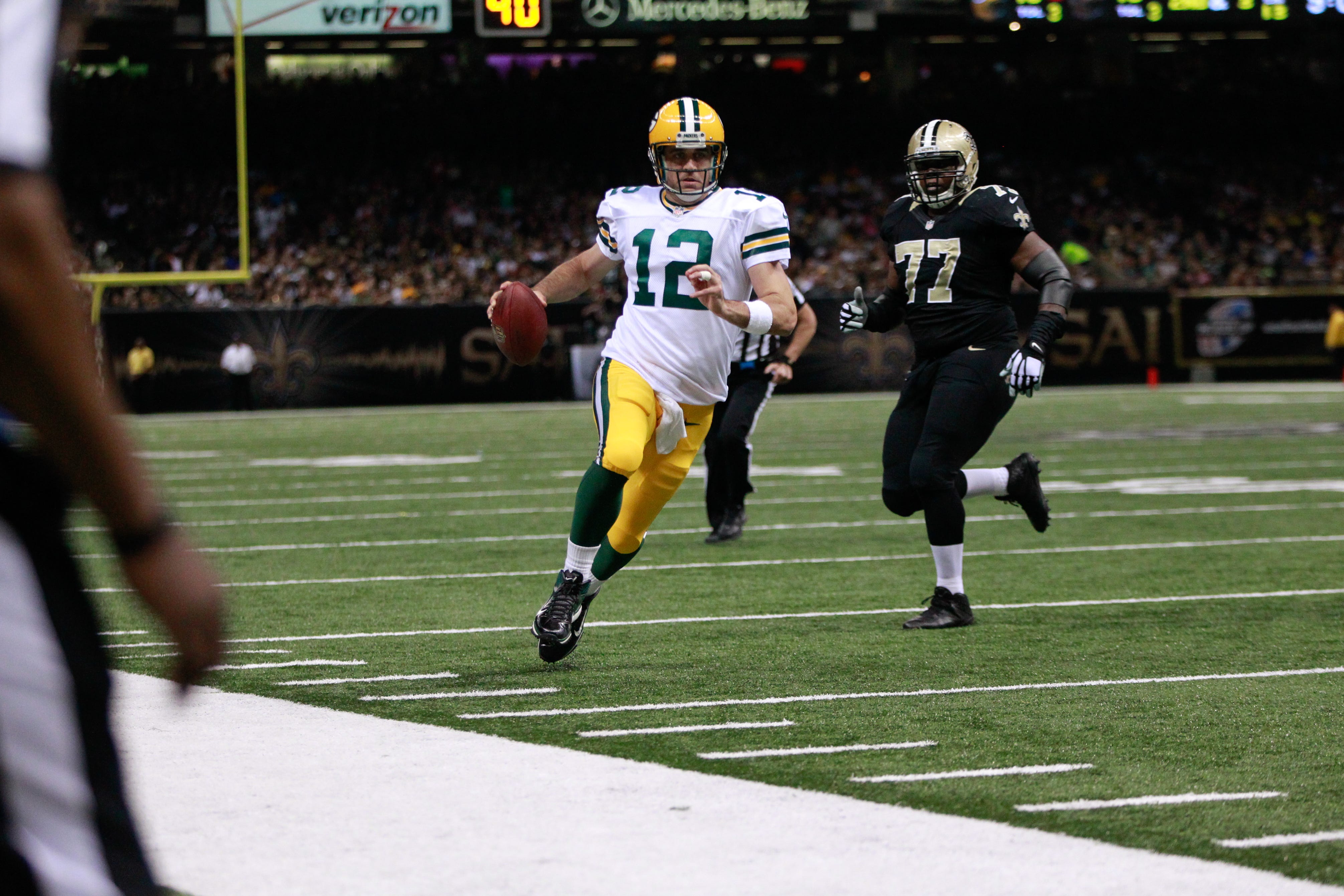 Green Bay Packers quarterback Aaron Rodgers runs for yardage against the New Orleans Saints on October 26, 2014, at the Mercedes-Benz Superdome in New Orleans, La. The Saints won 44-23.