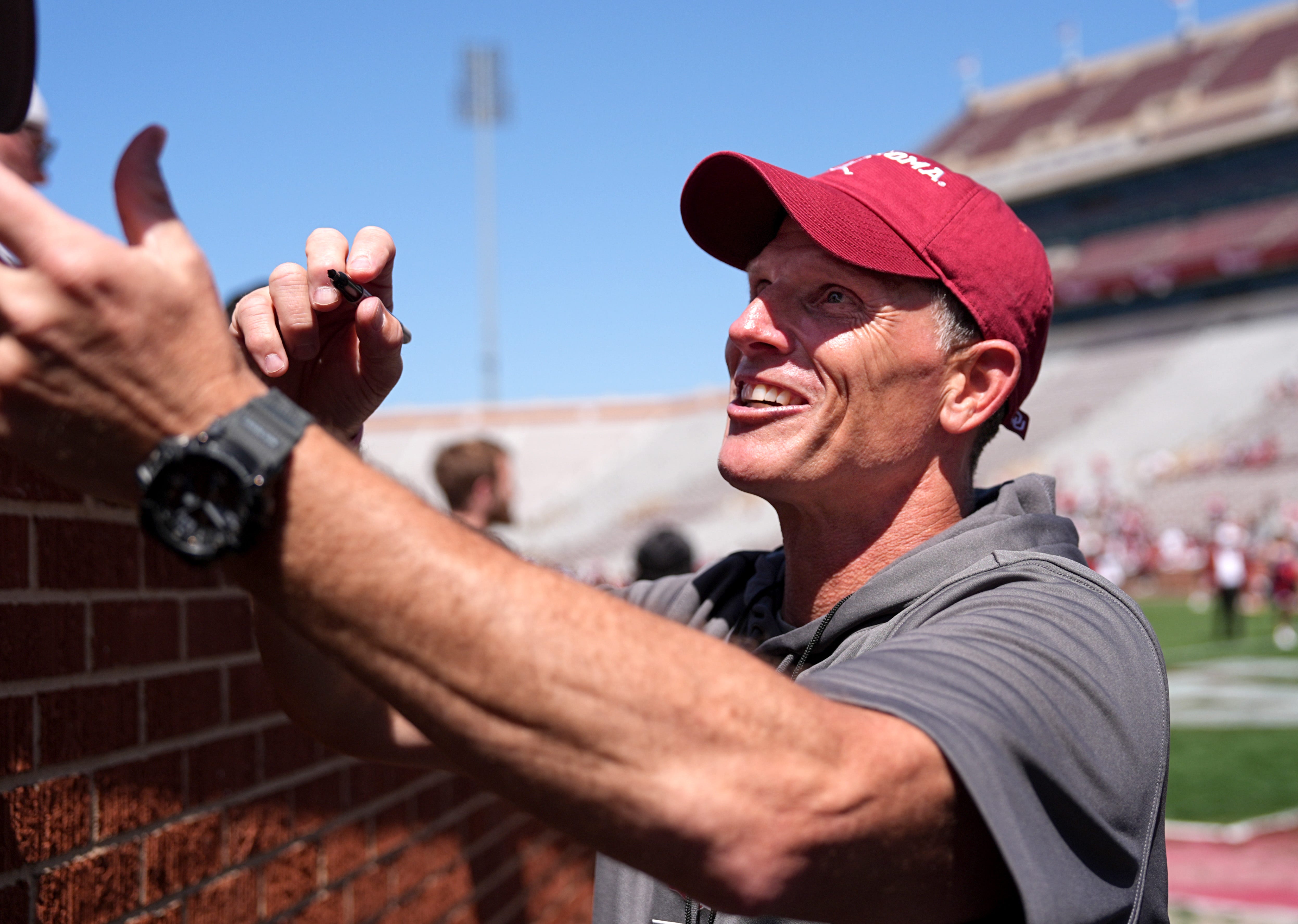 Oklahoma head football coach Brent Venables signs autographs during the University of Oklahoma Sooners Crimson Combine at Gaylord Family - Oklahoma Memorial Stadium in Norman, Okla., Saturday, April, 12, 2025.