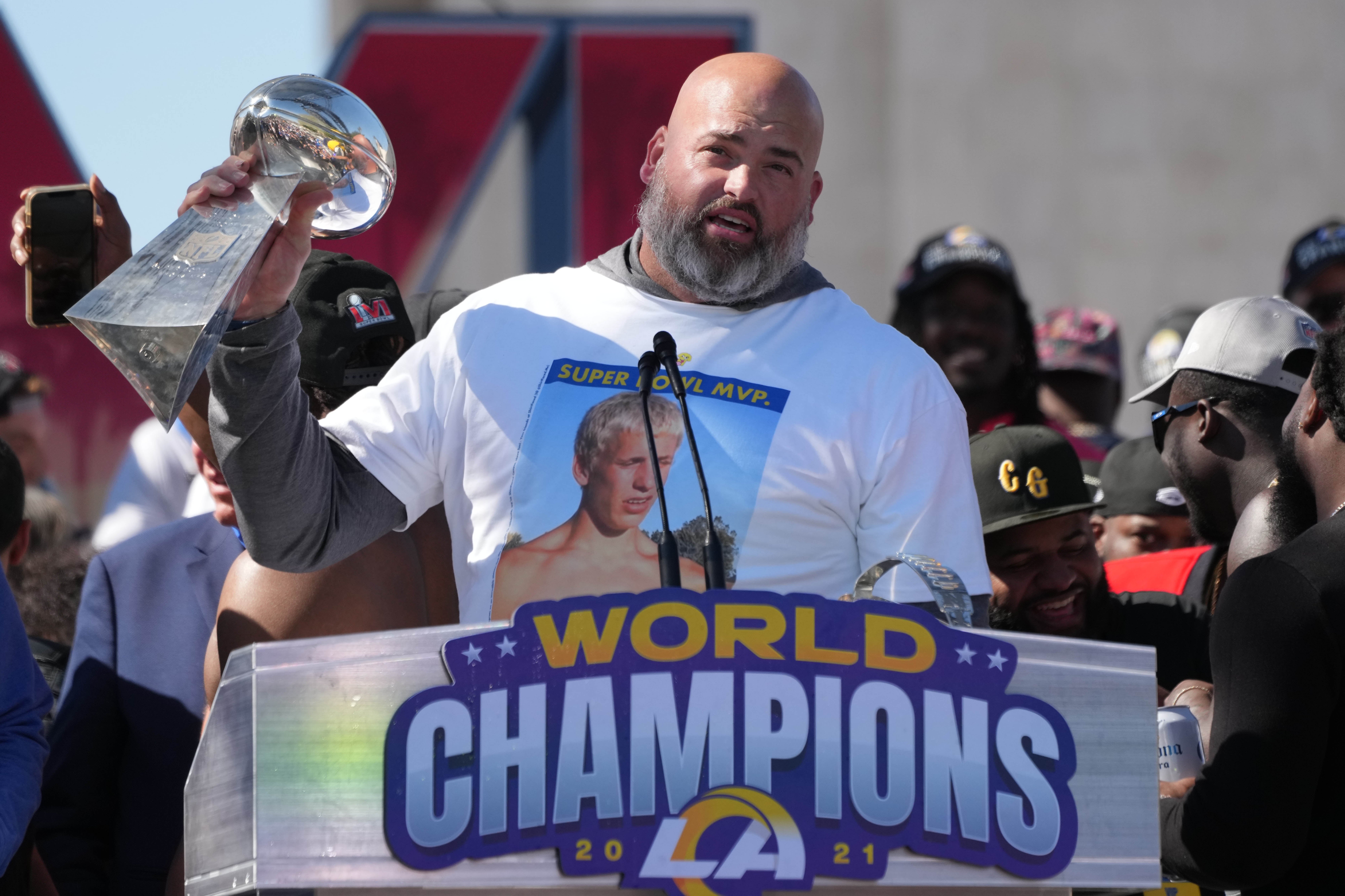 Feb 16, 2022; Los Angeles, CA, USA; Los Angeles Rams tackle Andrew Whitworth holds the Vince Lombardi trophy during the Super Bowl LVI championship rally at the Los Angeles Memorial Coliseum.