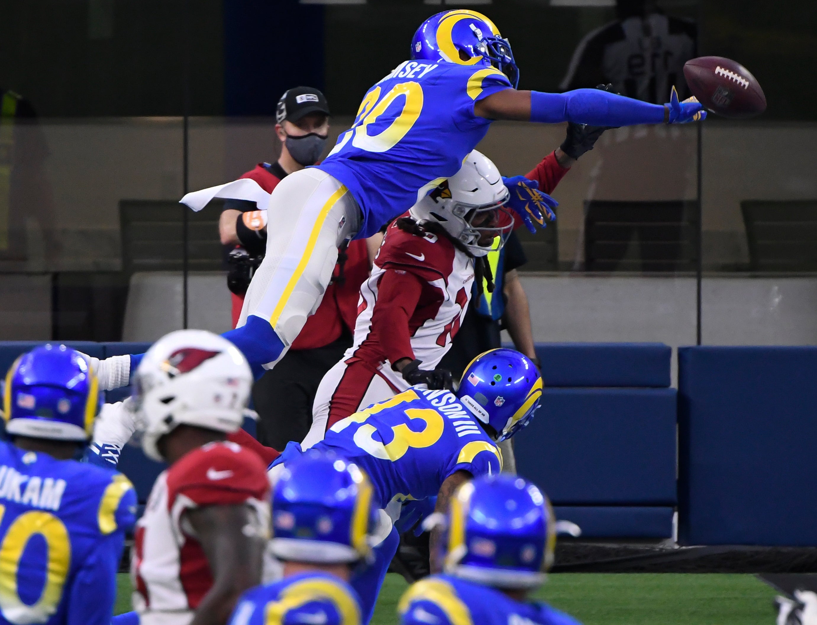 Jan 3, 2021; Inglewood, California, USA; Los Angeles Rams cornerback Jalen Ramsey (20) breaks up a pass in the end zone to Arizona Cardinals wide receiver DeAndre Hopkins (10) during the fourth quarter at SoFi Stadium.