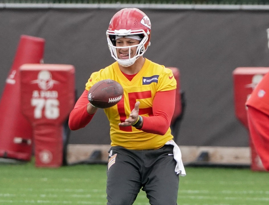 May 26, 2022; Kansas City, MO, USA; Kansas City Chiefs quarterback Patrick Mahomes (15) takes a snap during organized team activities at The University of Kansas Health System Training Complex.