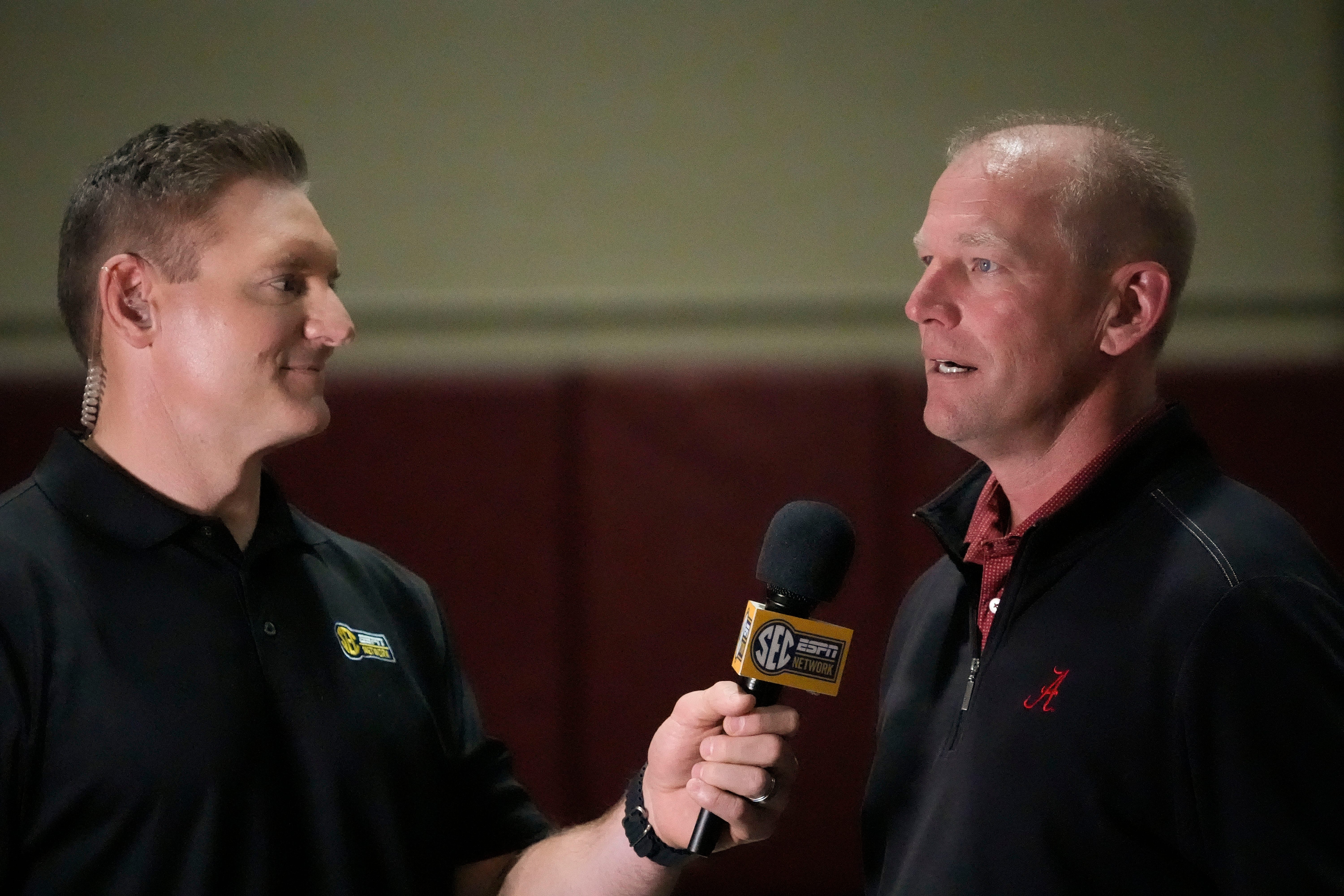 Mar 19, 2025; Tuscaloosa AL, USA; Alabama football coach Kalen DeBoer is interviewed during the University of Alabama Pro Day as several Crimson Tide players worked out for NFL teams in the Hank Crisp Indoor Practice Facility.