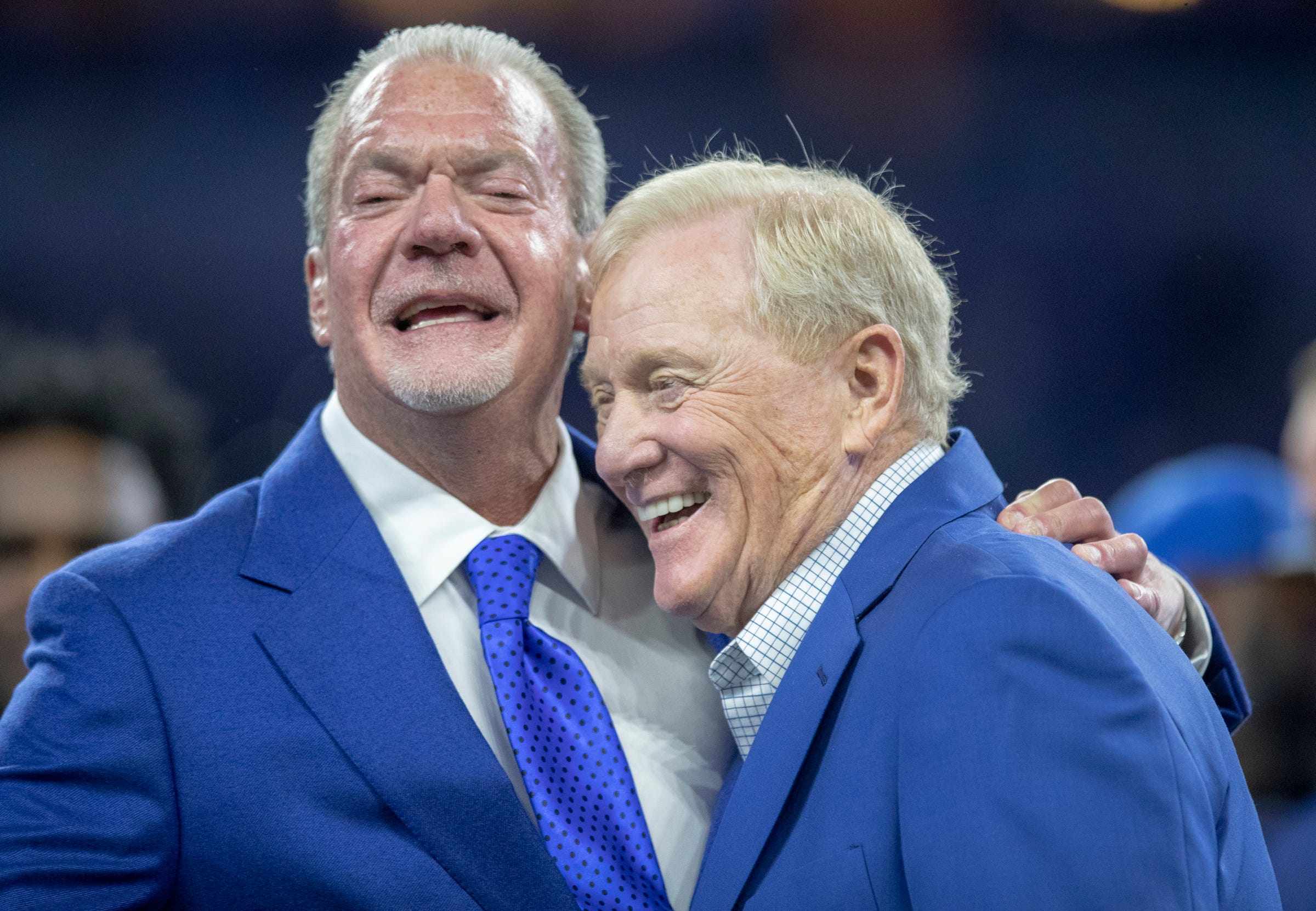 Jim Irsay (left), embraces Bill Polian, during a Ring of Honor celebration for Dwight Freeney, Miami Dolphins at Indianapolis Colts, Sunday, Nov. 10, 2019. Dolphins At Colts