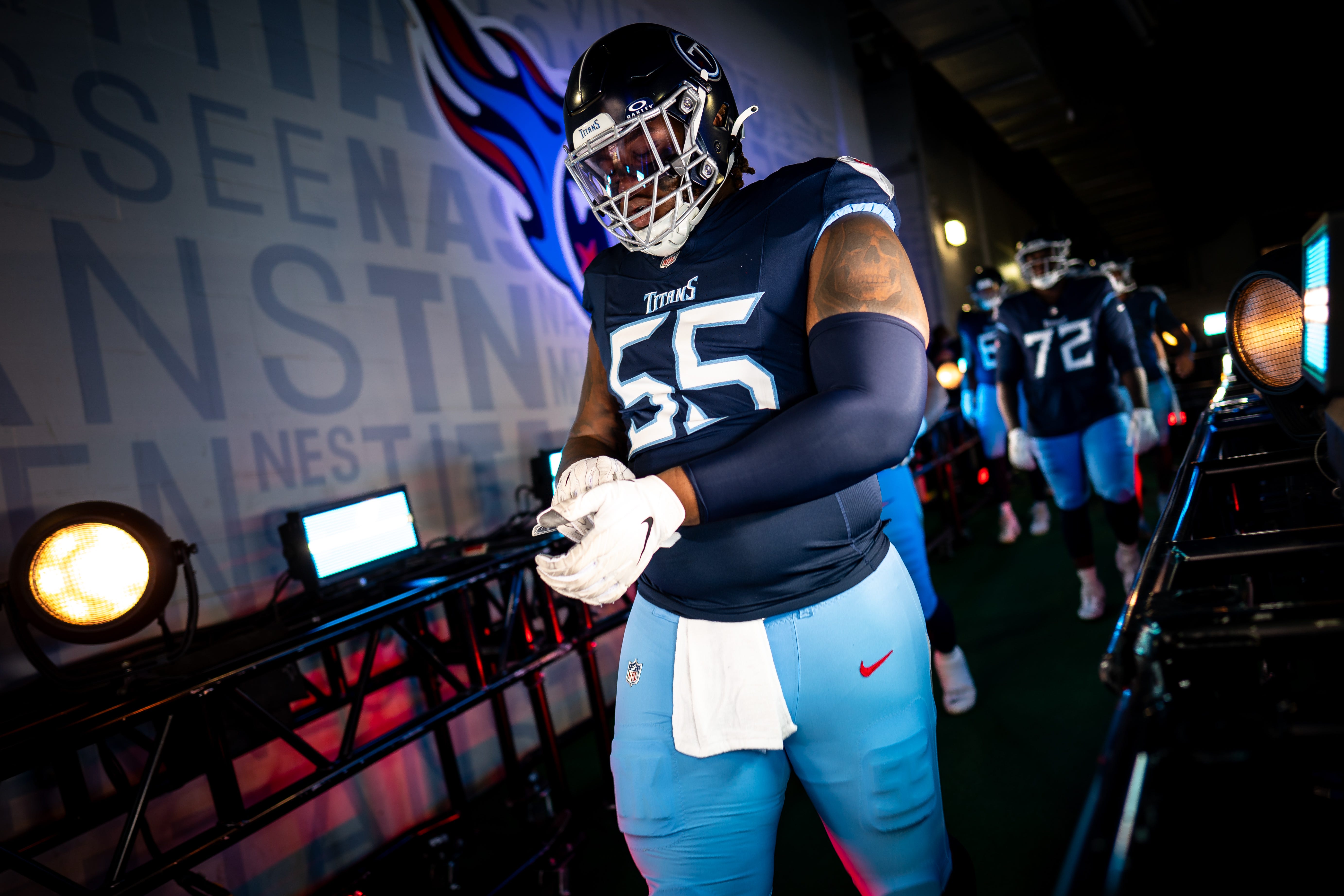 Tennessee Titans offensive tackle JC Latham (55) heads ot the field before a game against the New England Patriots at Nissan Stadium in Nashville, Tenn., Sunday, Nov. 3, 2024.