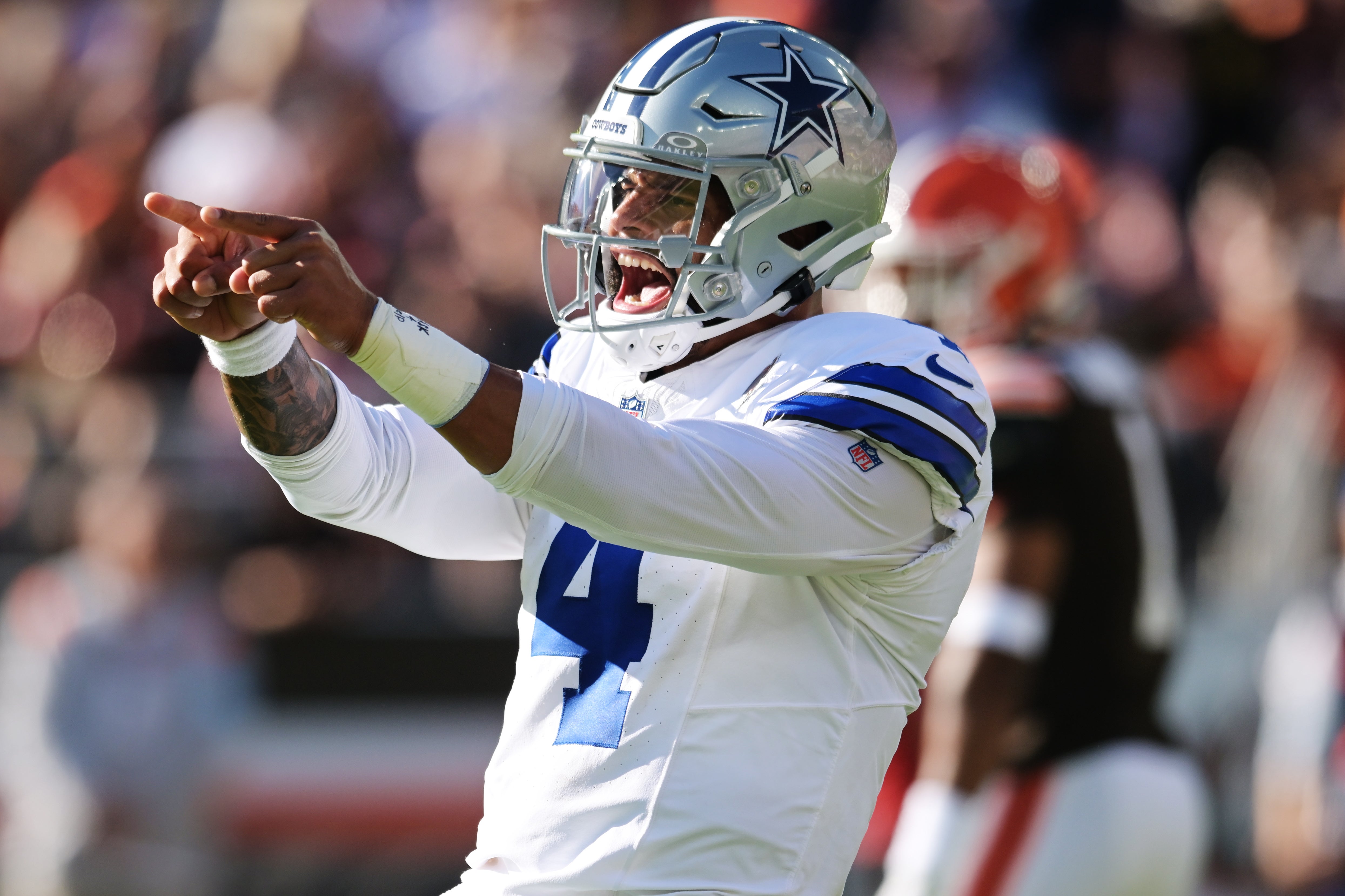 Dallas Cowboys quarterback Dak Prescott (4) celebrates after a touchdown during the first half against the Cleveland Browns at Huntington Bank Field.