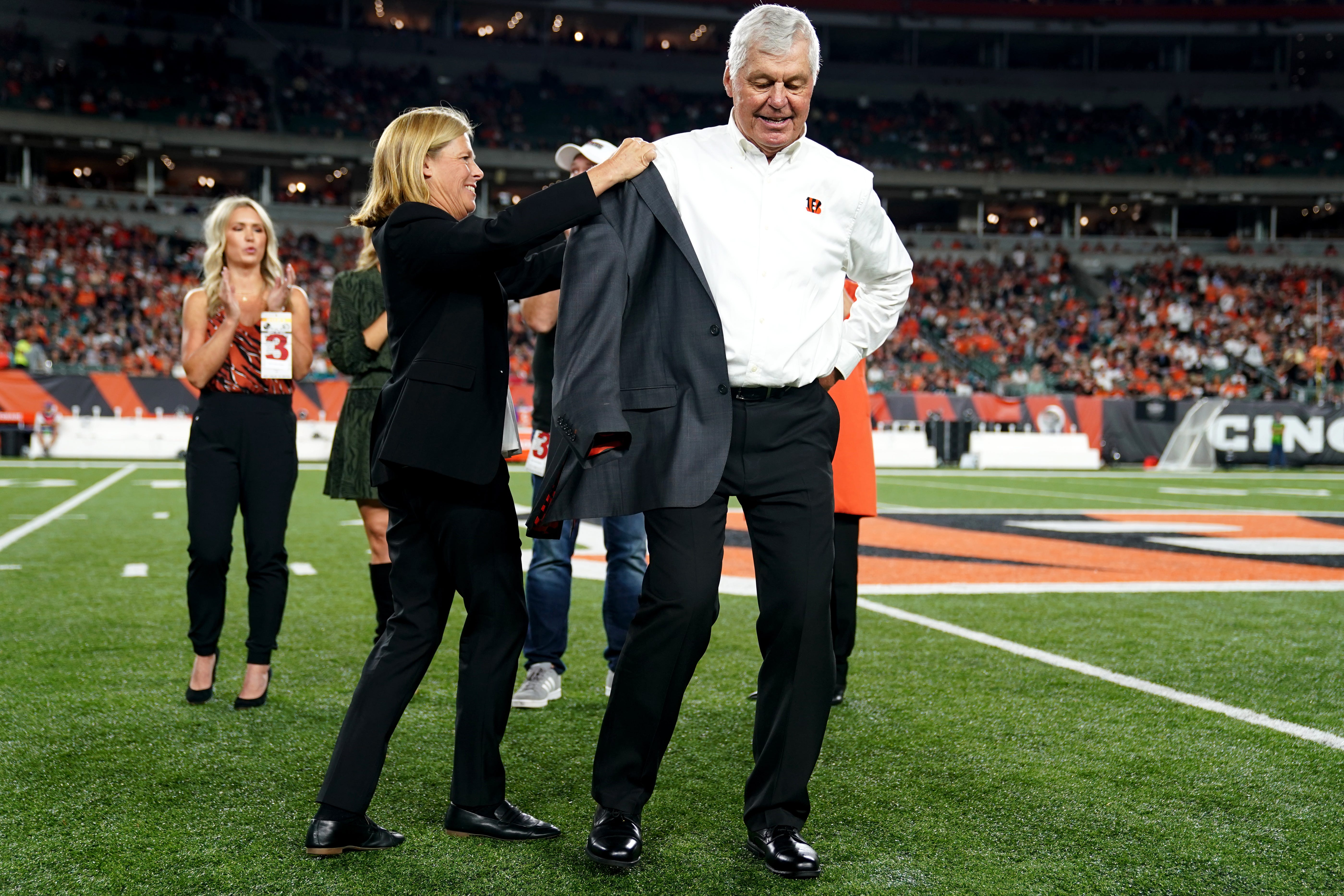 Former Cincinnati Bengals quarterback Ken Anderson is inducted into the team's Ring of Honor with the help of Executive Vice President Katie Blackburn during halftime in of a Week 4 NFL football game between the Jacksonville Jaguars and the Cincinnati Bengals, Thursday, Sept. 30, 2021, at Paul Brown Stadium in Cincinnati. Jacksonville Jaguars at Cincinnati Bengals.