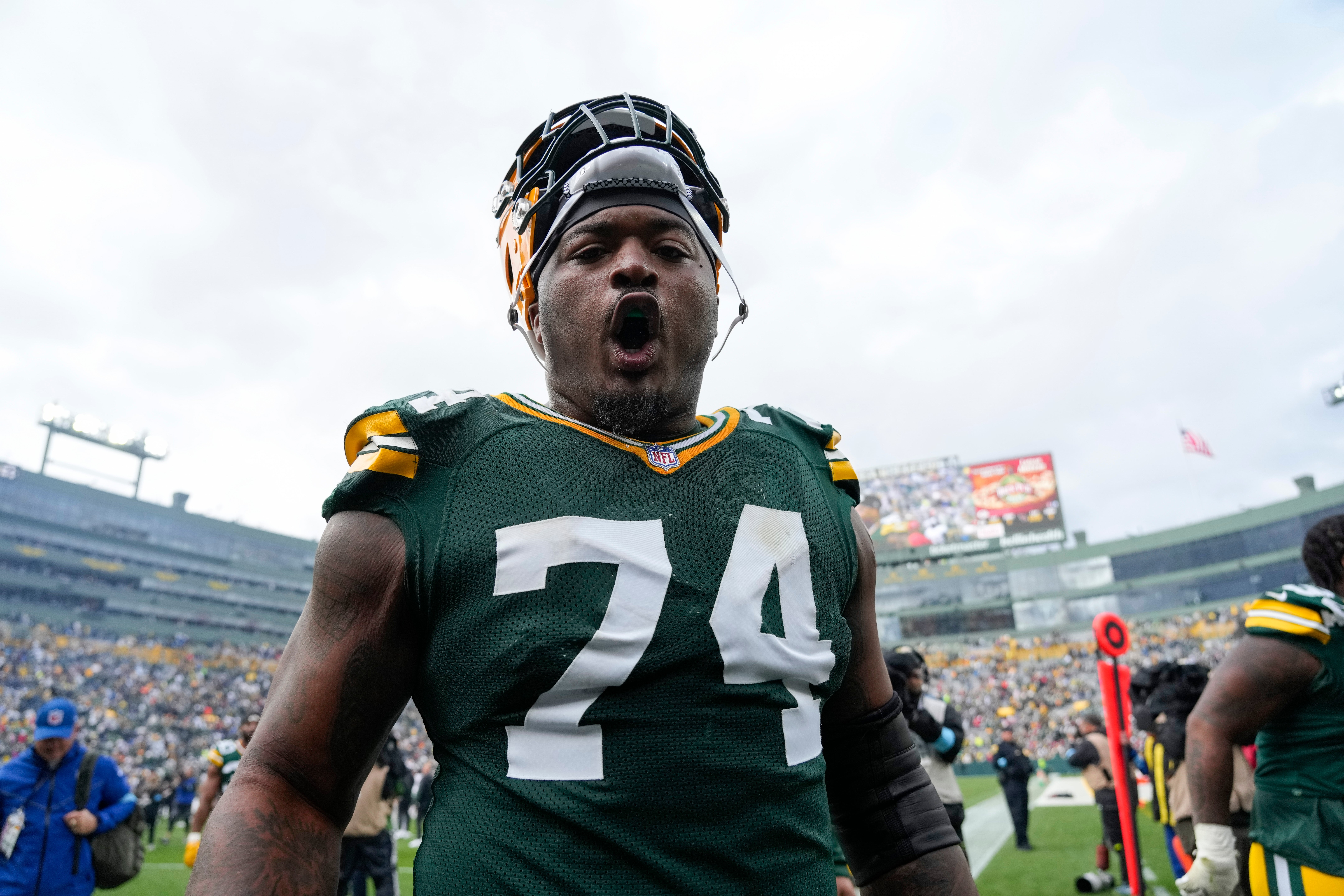 Green Bay Packers guard Elgton Jenkins (74) celebrates following the game against the Arizona Cardinals at Lambeau Field.