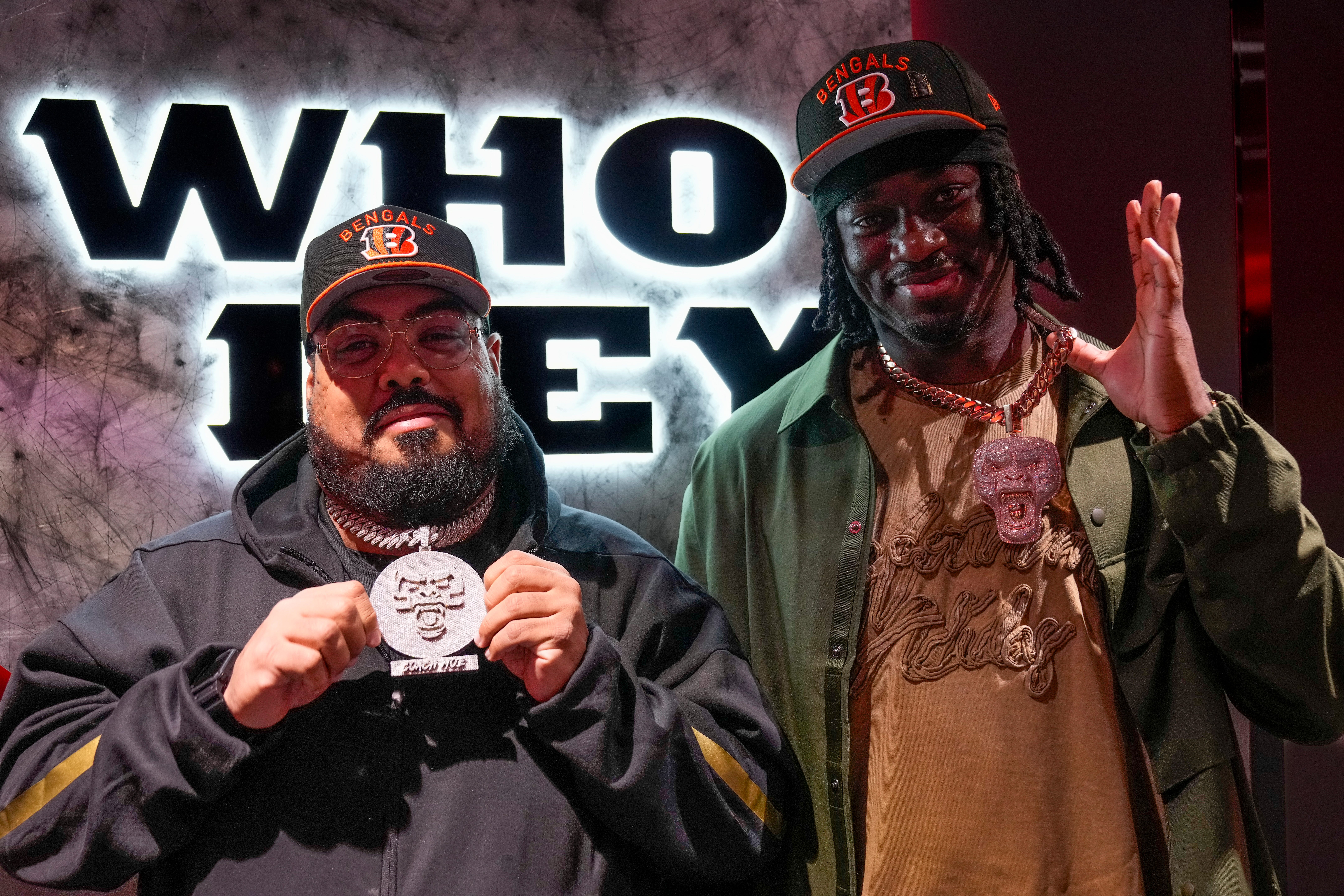 Cincinnati Bengals first round draft pick Shemar Stewart and his dad Moe Marquez show off custom jewelry they had made for each other in the Bengals locker room at Paycor Stadium in downtown Cincinnati on Friday, April 25, 2025.  