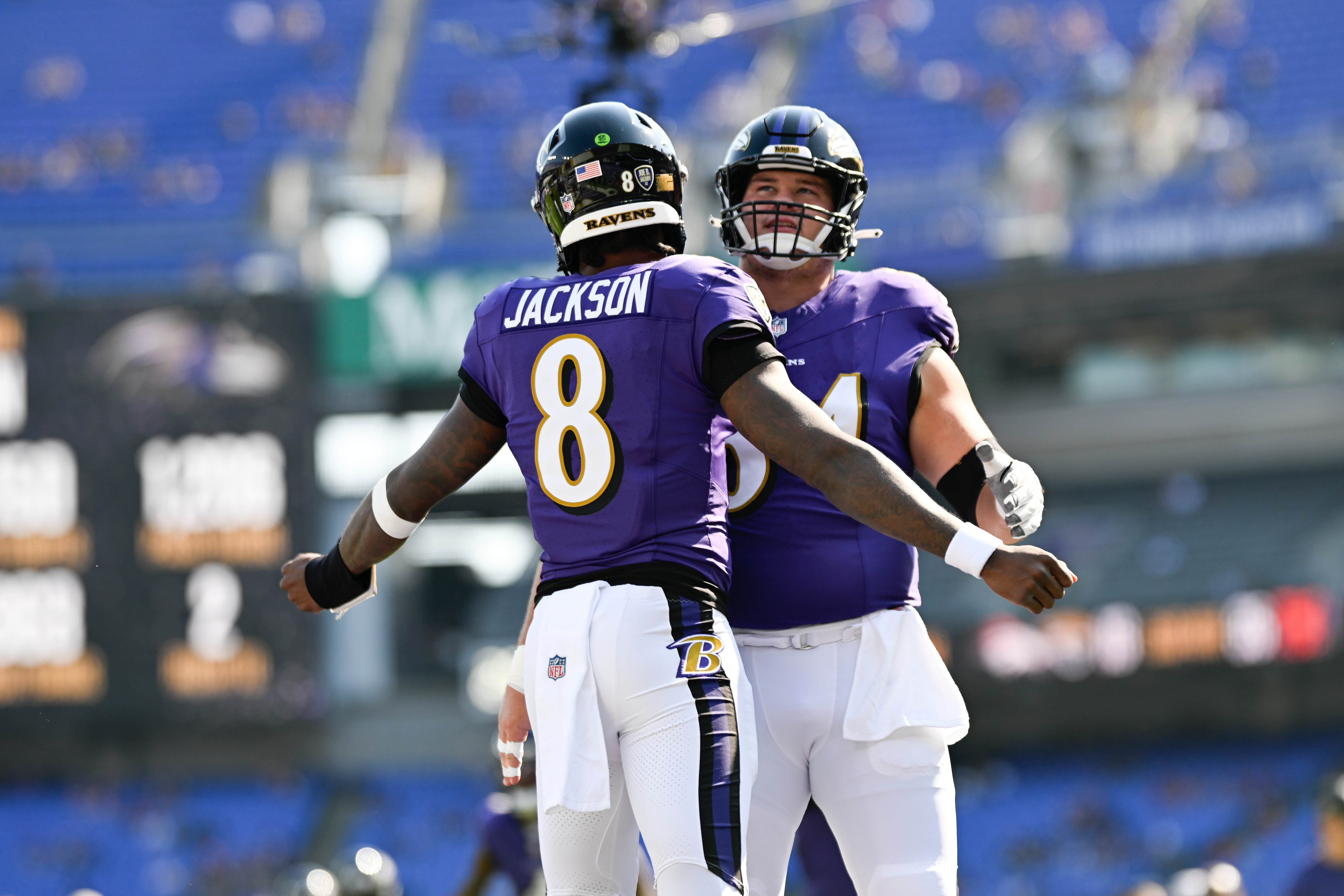 Oct 13, 2024; Baltimore, Maryland, USA; Baltimore Ravens quarterback Lamar Jackson (8) and center Tyler Linderbaum (64) chest bump before the game against the Washington Commanders at M&T Bank Stadium.