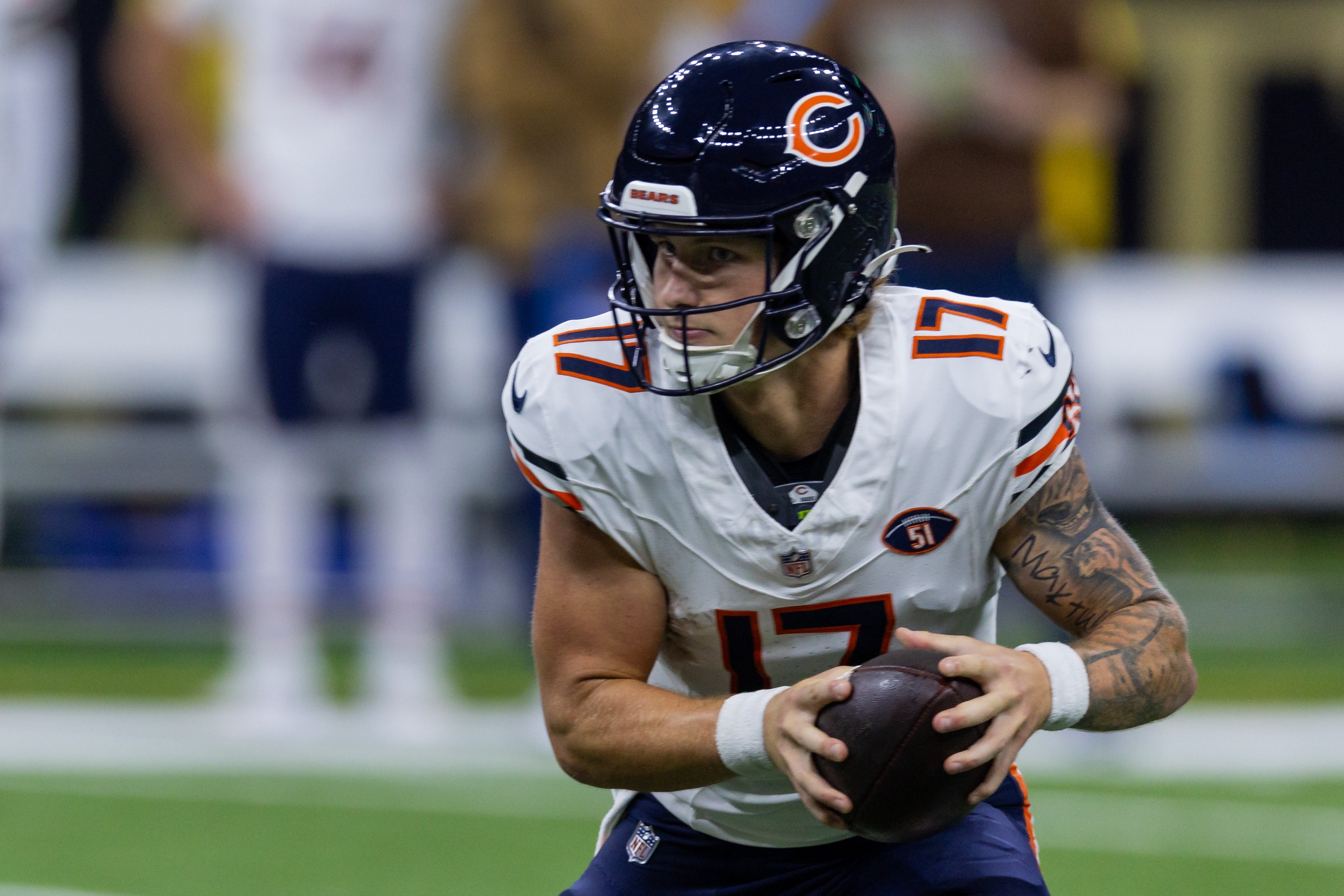 Nov 5, 2023; New Orleans, Louisiana, USA; Chicago Bears quarterback Tyson Bagent (17) is rushed out of the pocket by the New Orleans Saints during the first half at the Caesars Superdome.