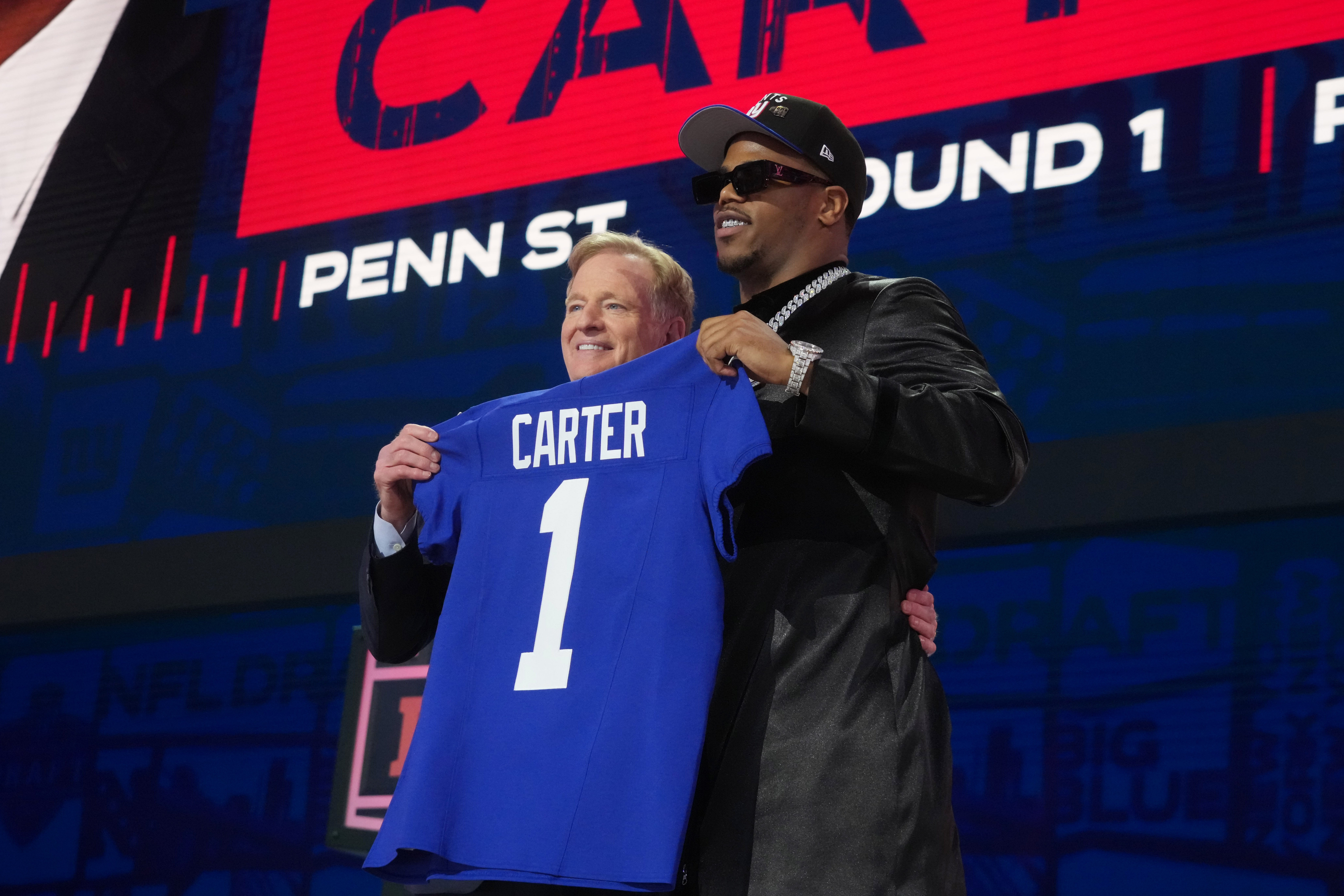 Apr 24, 2025; Green Bay, WI, USA; NFL commissioner Roger Goodell with Penn State Nittany Lions defensive end Abdul Carter after he is selected by the New York Giants as the number three pick in the first round of the 2025 NFL Draft at Lambeau Field.