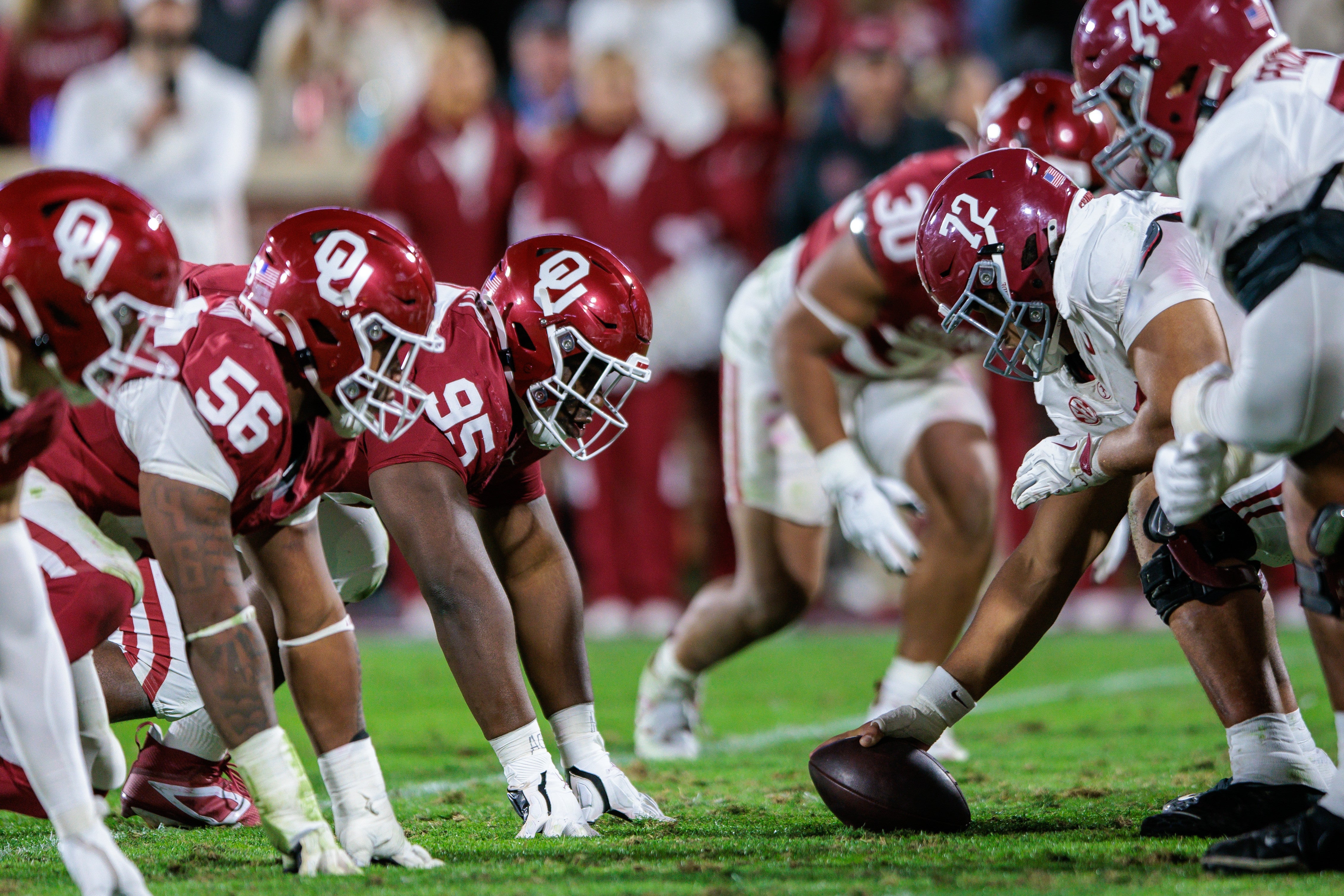 Nov 23, 2024; Norman, Oklahoma, USA; Oklahoma Sooners defensive line ready for the play against the Alabama Crimson Tide during the fourth quarter at Gaylord Family-Oklahoma Memorial Stadium.