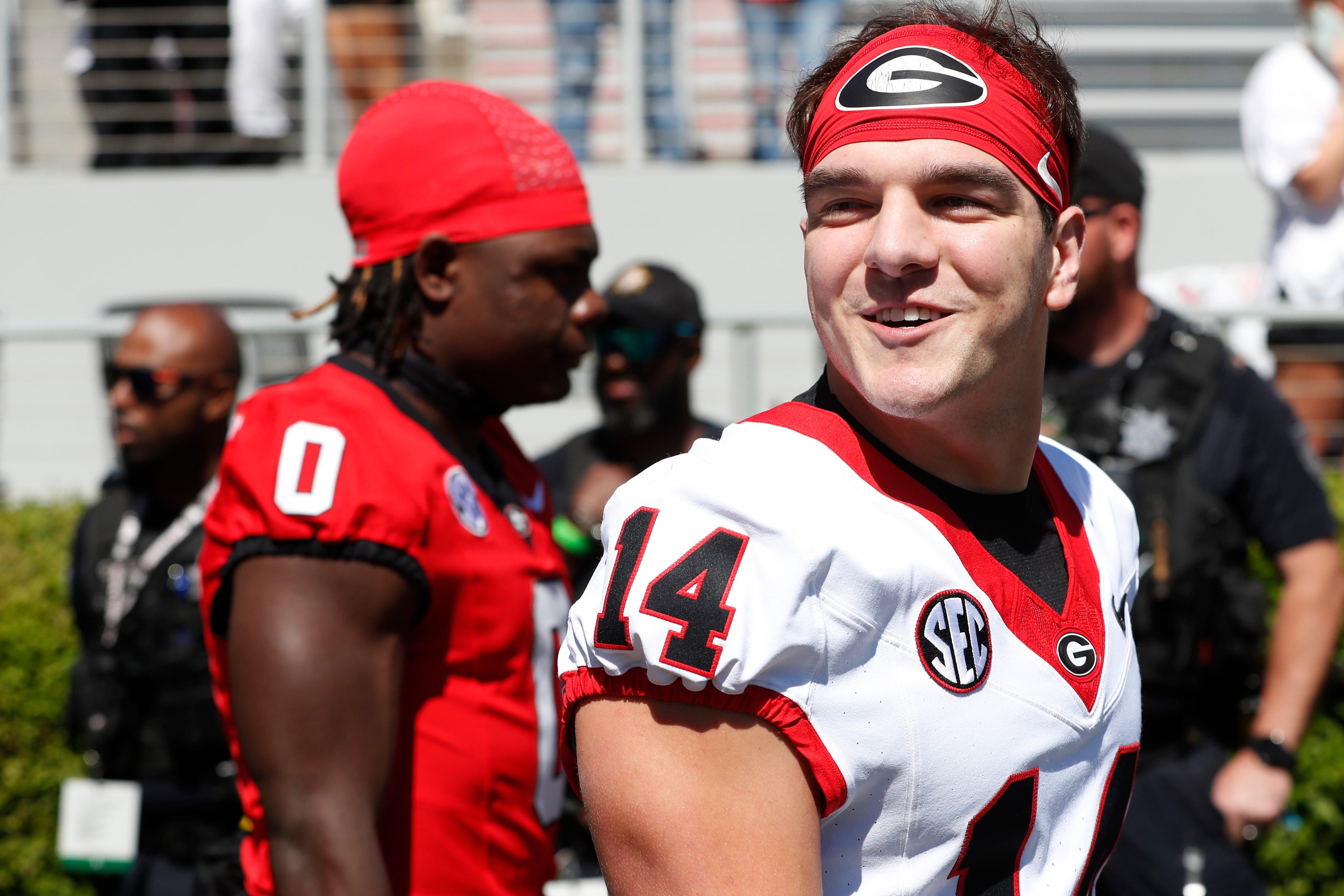 Georgia quarterback Gunner Stockton (14) arrives with the team before the start of the G-Day spring football game in Athens, Ga., on Saturday, April 13, 2024.