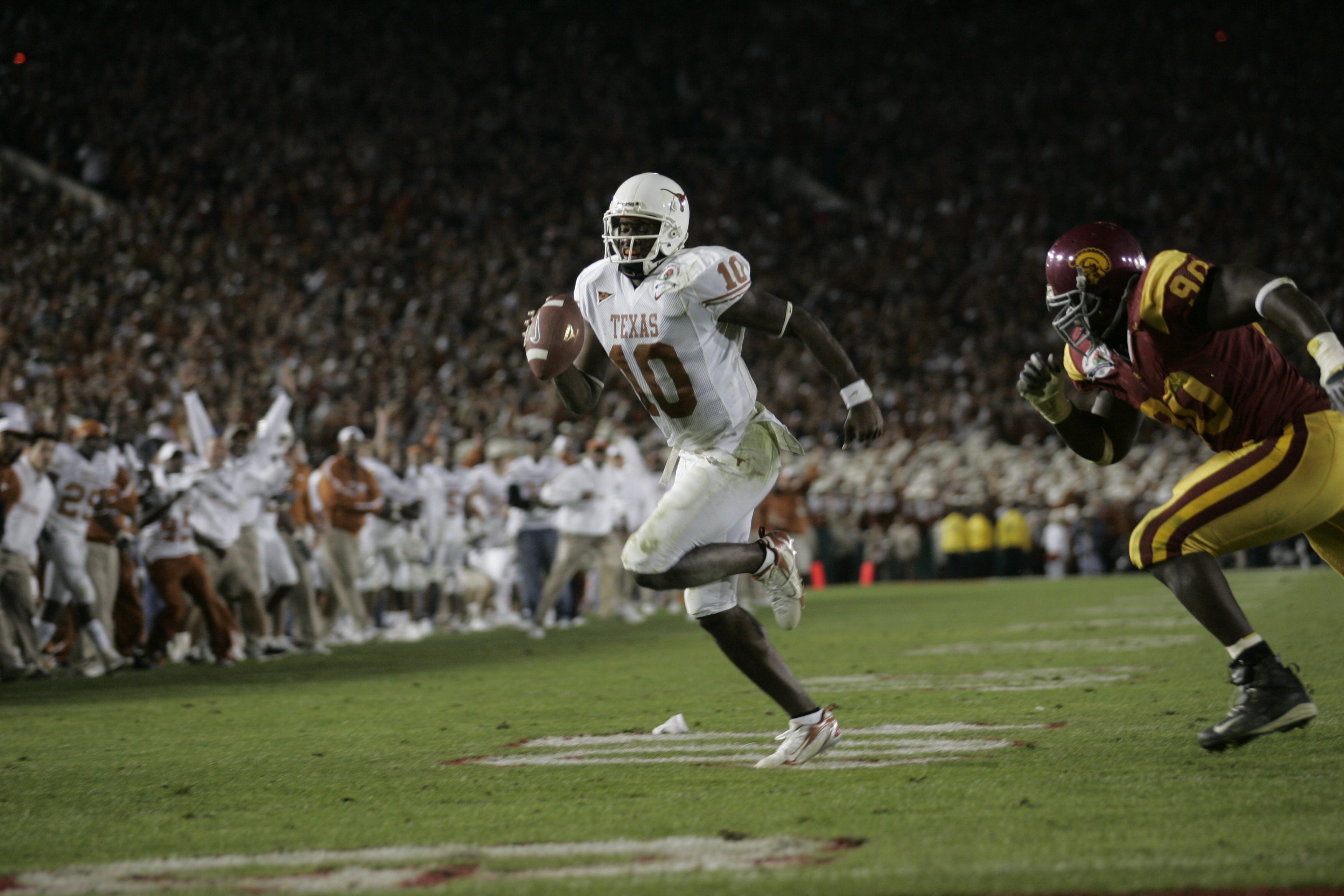 Texas quarterback Vince Young outruns the Southern California defense for the game-winning touchdown in the 2006 Rose Bowl in Pasadena, Calif. 2006-01-04-vince young